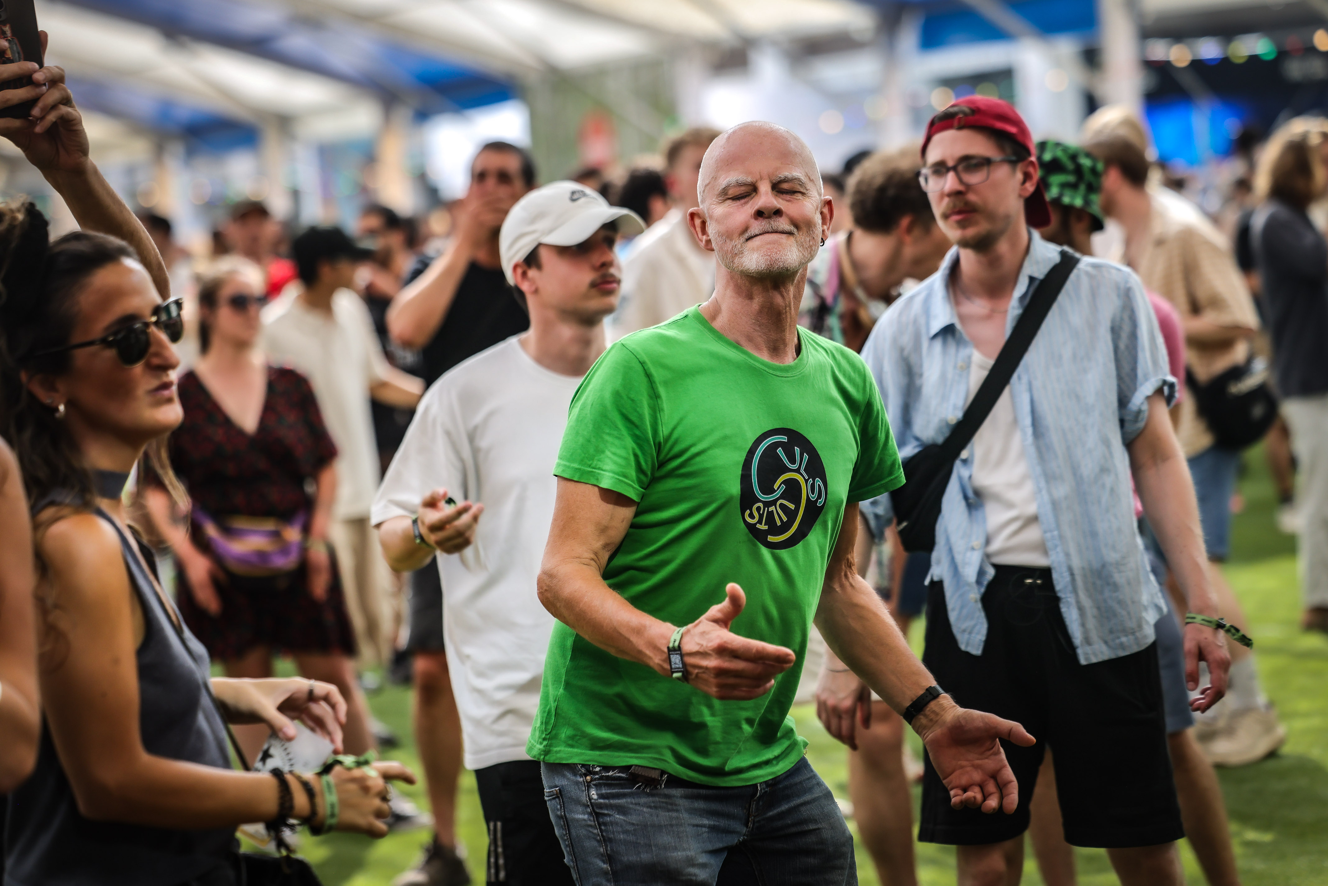 Several attendees at the 2025 Sónar music festival dance in Barcelona
