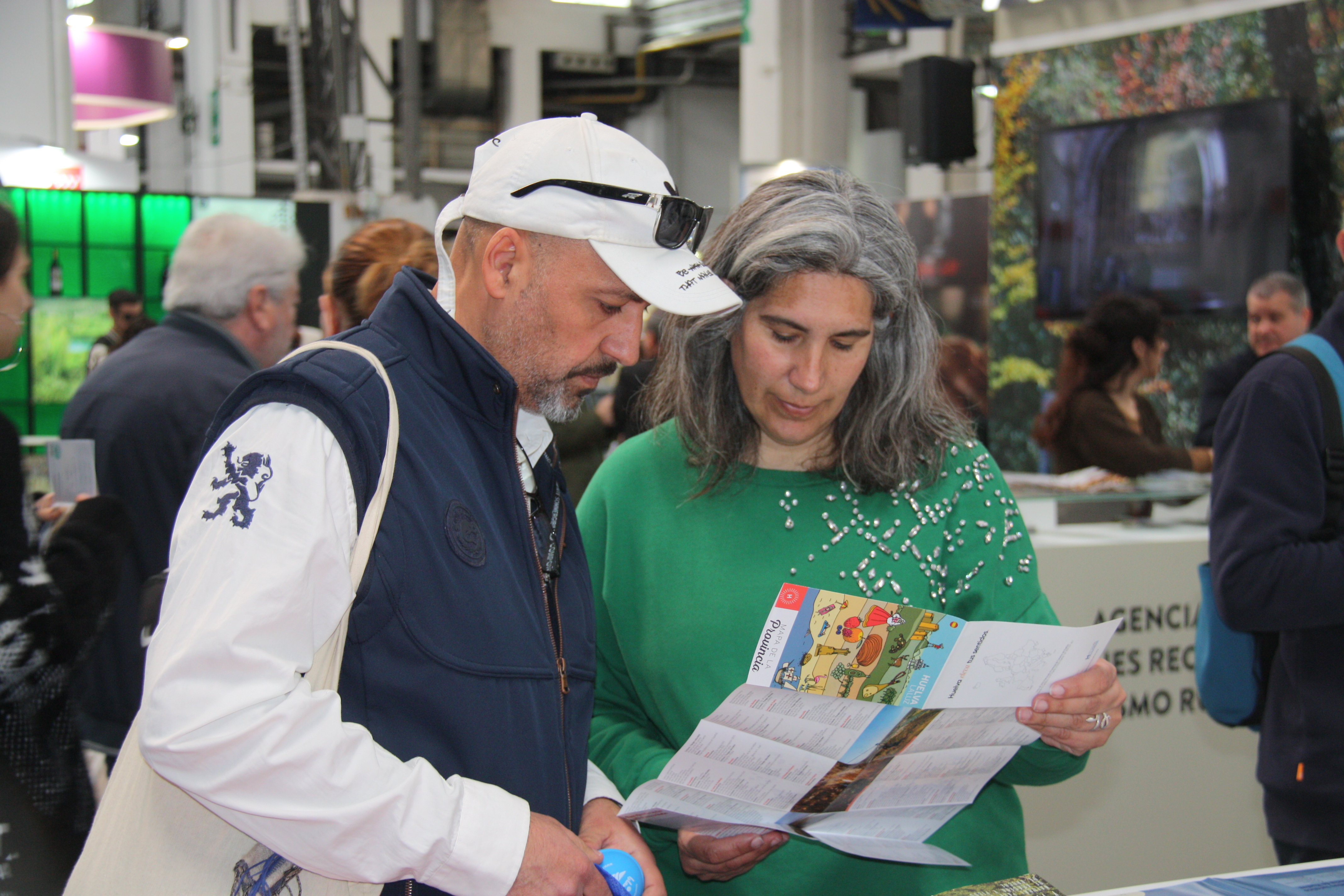 B-Travel tourism fair visitors checking touristic information regarding Spain’s Huelva region on March 24, 2023