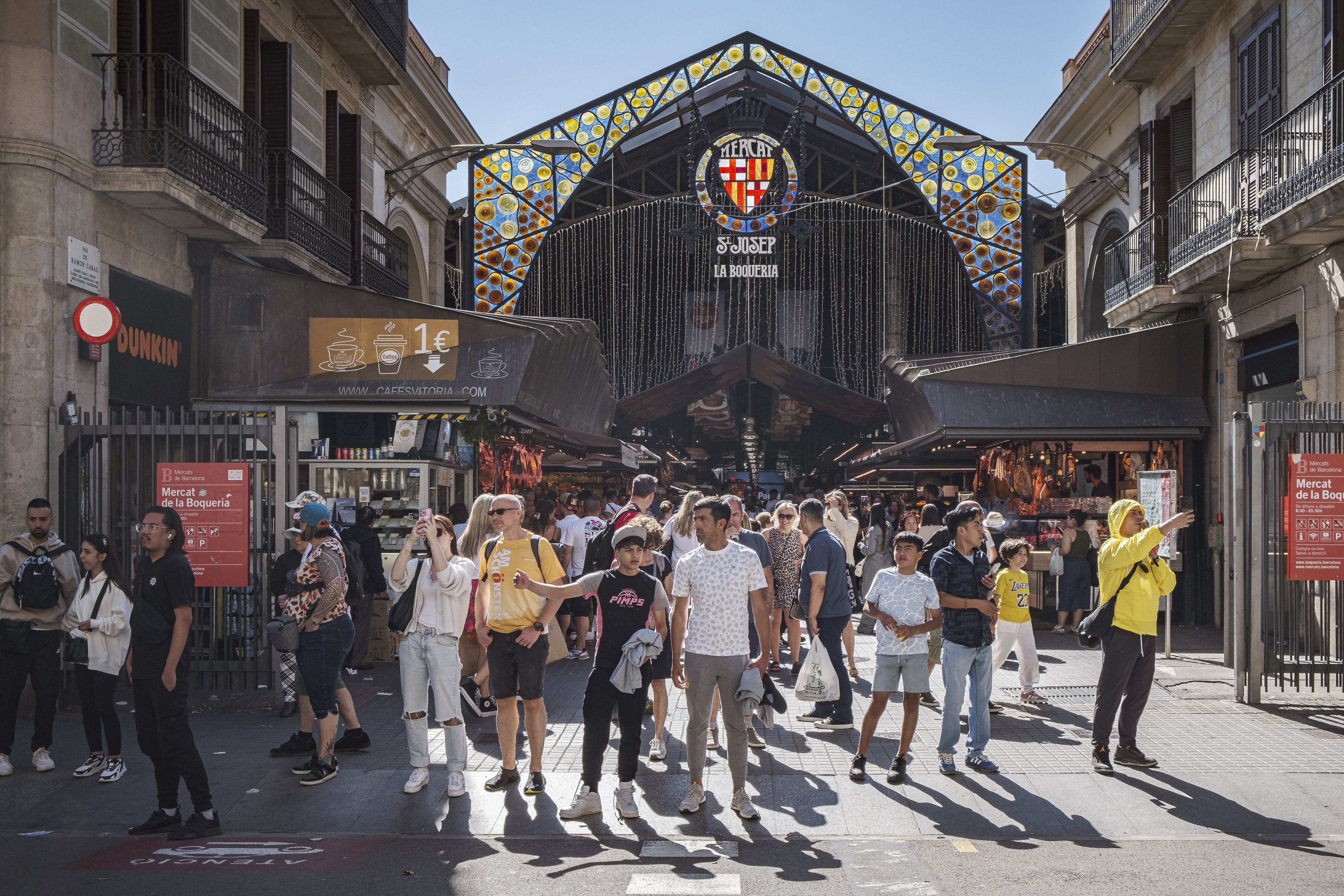 Dozens of tourists in front of the Mercat de la Boqueria or Mercat de Sant Josep on la Rambla boulevard