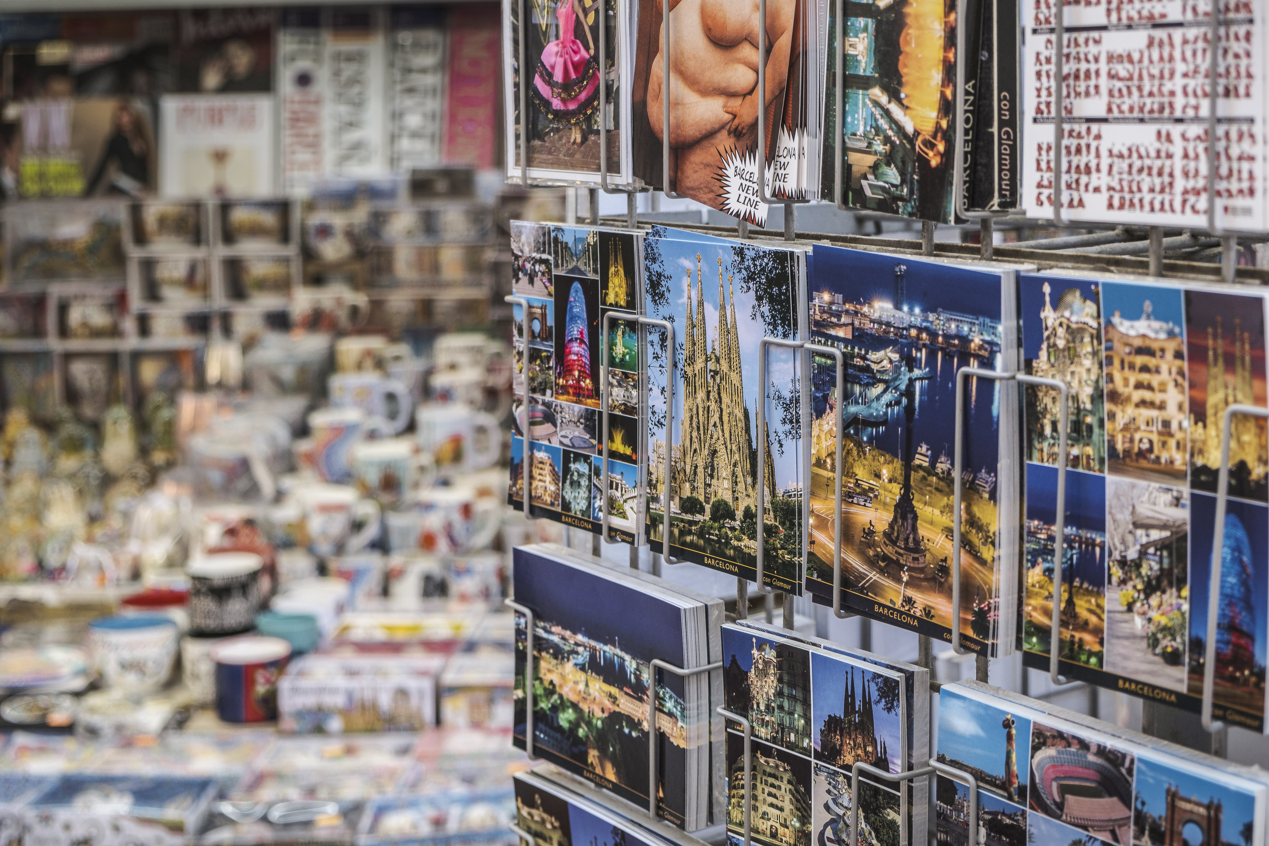 Postcards for tourists to buy in Barcelona include La Sagrada Família basilica and other buildings by architect Antoni Gaudí