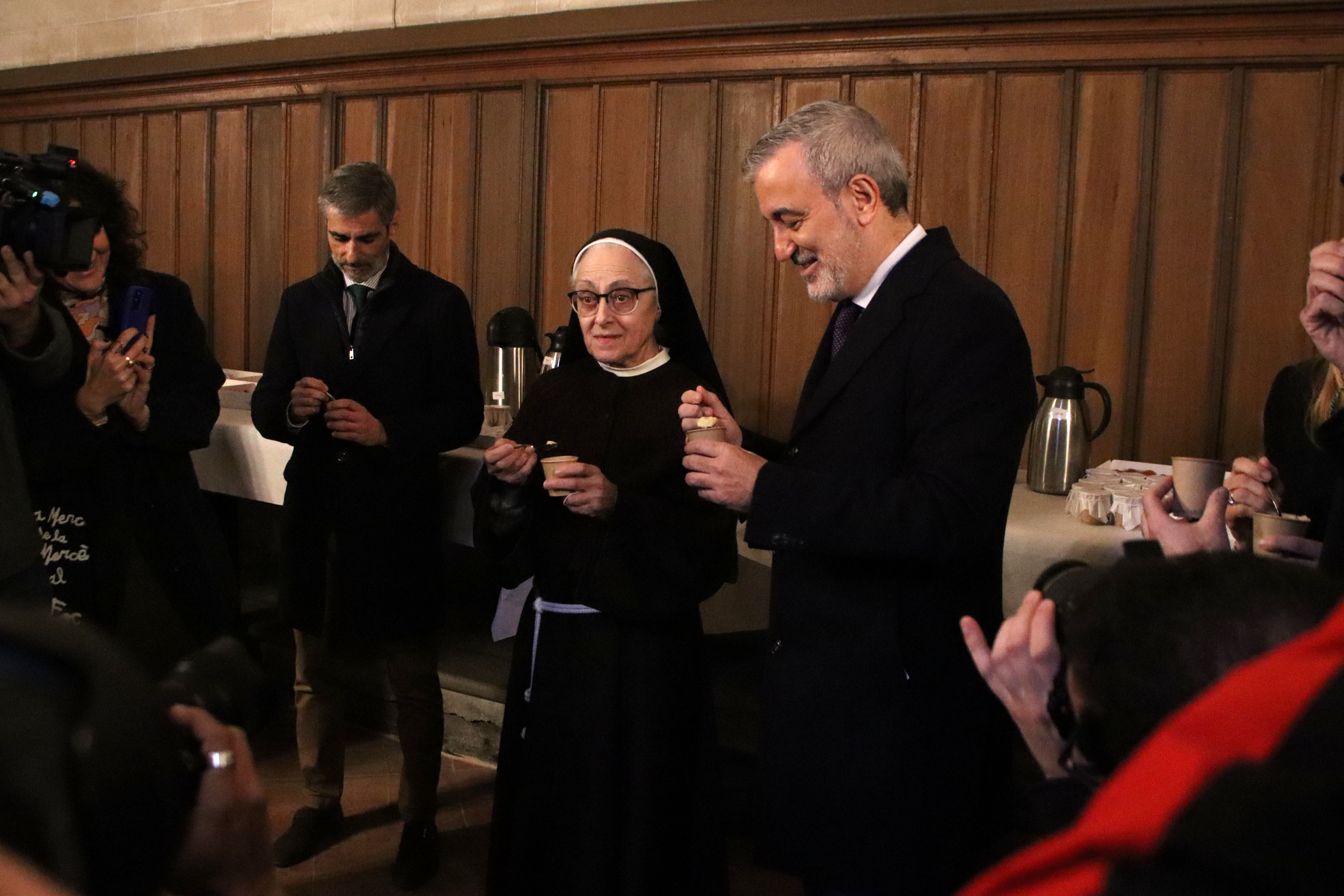 Collboni and one of the Poor Clare's nuns eat the traditional mató cheese dessert