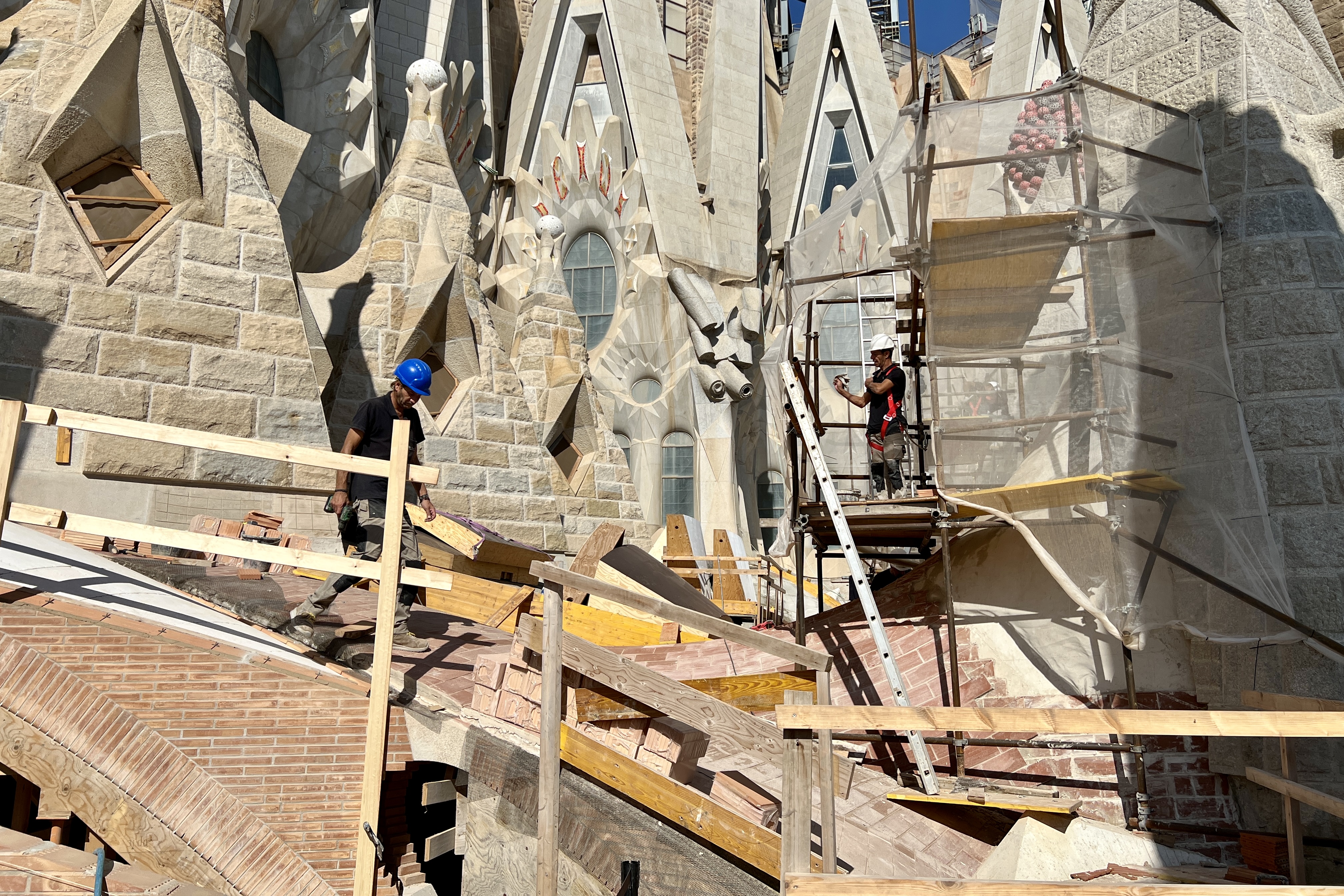 Two construction workers during a work visit at the Sagrada Família Basilica on September 19, 2024