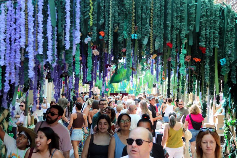 Visitors pack into a Gràcia street