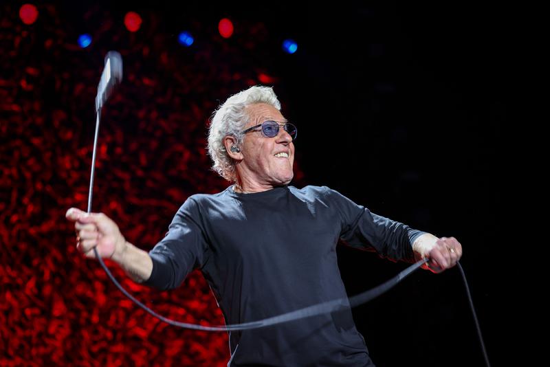 Rock band The Who's singer Roger Daltrey plays with his microphone during a concert in Barcelona's Palau Sant Jordi music hall on June 14, 2023