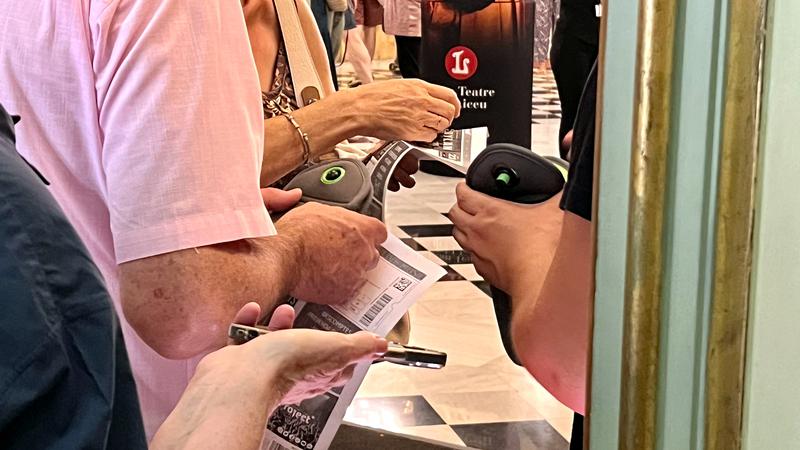 Fans at the Bob Dylan concert in Barcelona leave their phones in cases ahead of the performance