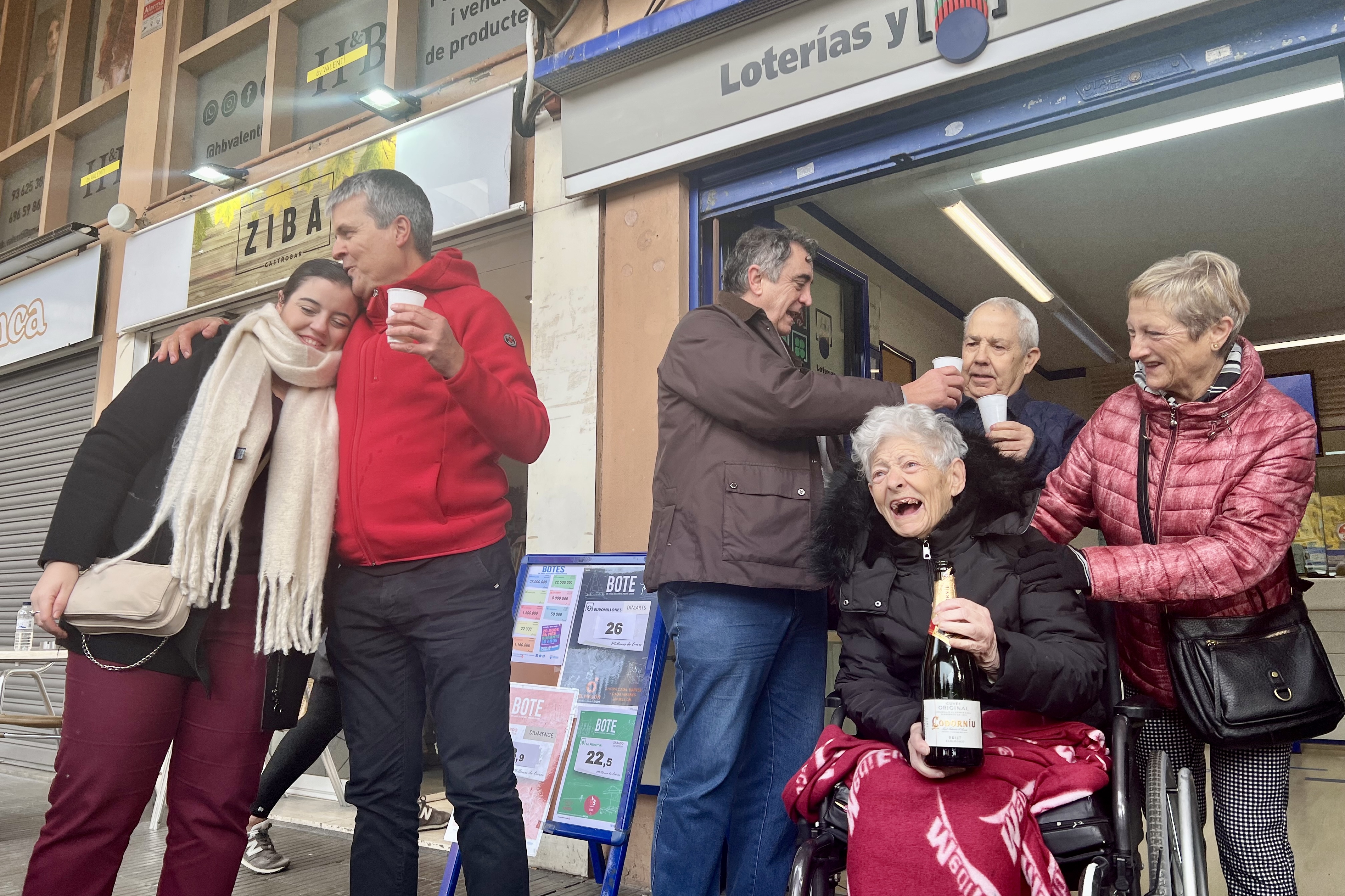 Blancafort hotel director celebrates with family members and the owner of the lottery administration in La Garriga celebrate having a winning number for the 2024 Christmas lottery