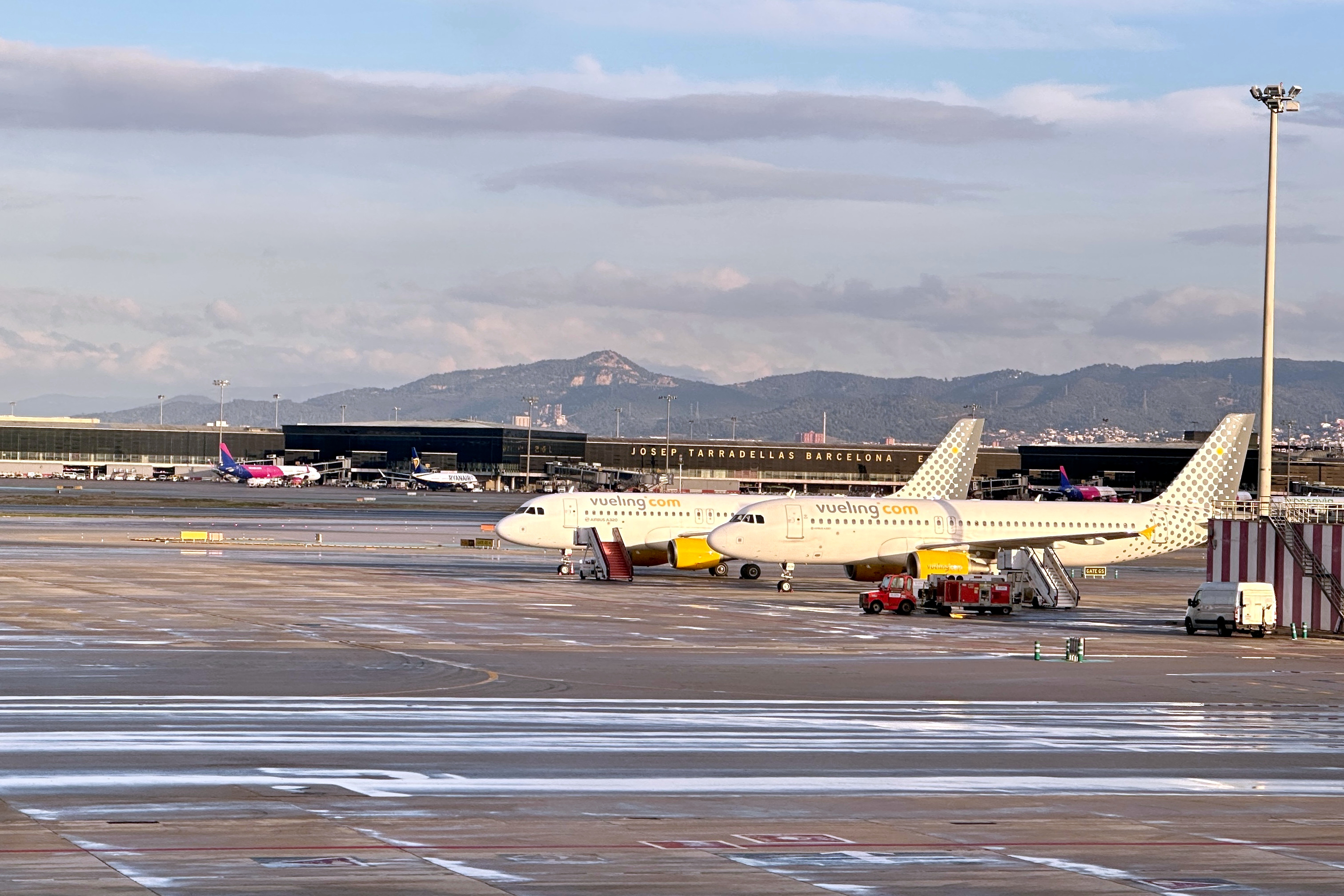 Two Vueling airplanes parked at Josep Tarradellas Barcelona-El Prat airport