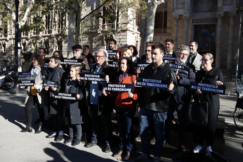 Members of civic and legal entities protest in front of the Catalan High Court building 