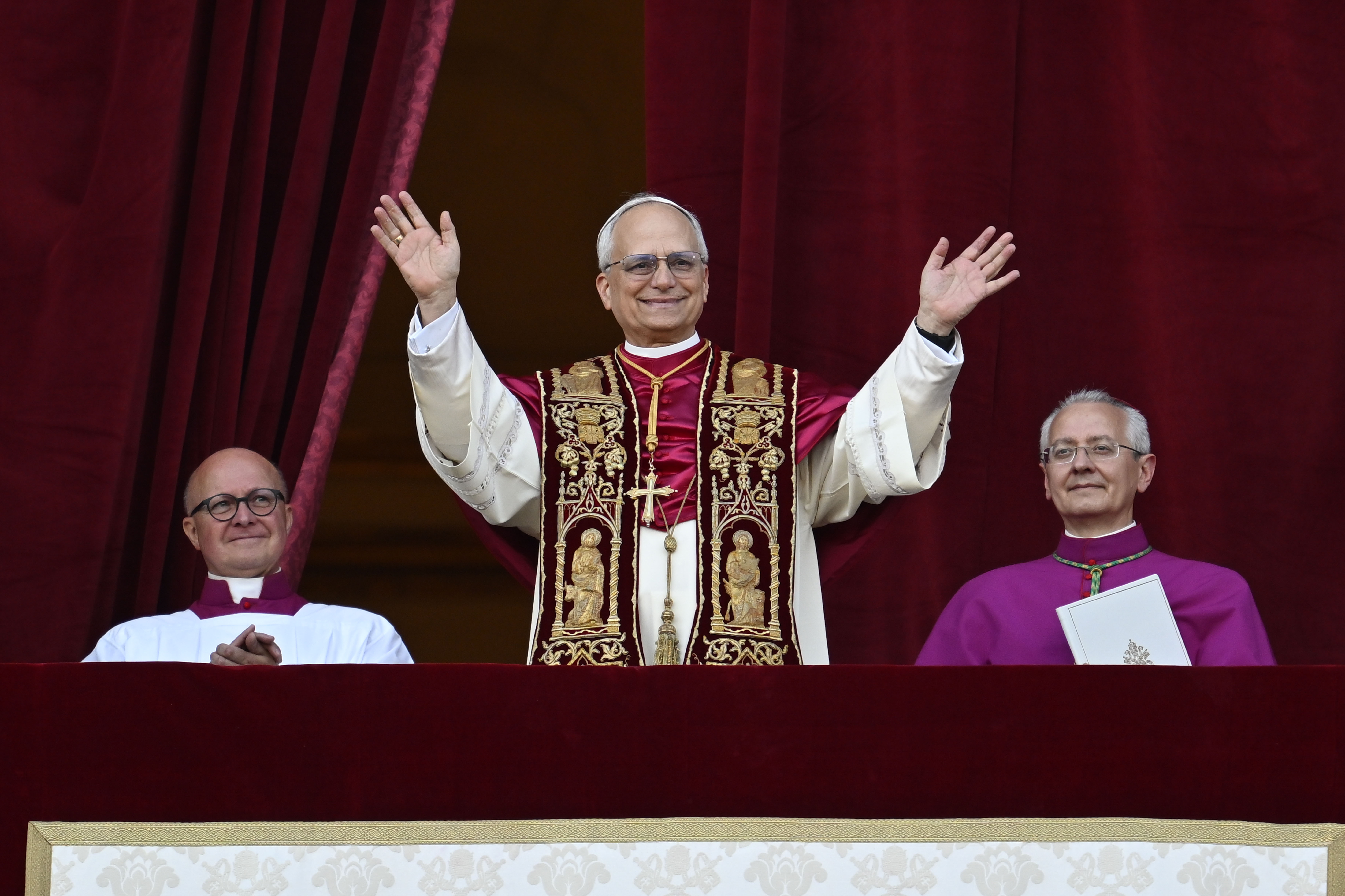 Pope Leo XIV greets the faithful gathered in St. Peter's Square at the Vatican during his first 'Urbi et Orbi' blessing as pontiff