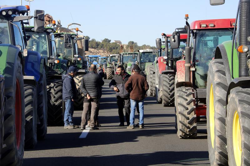 Farmers block the A-2 highway during a protest