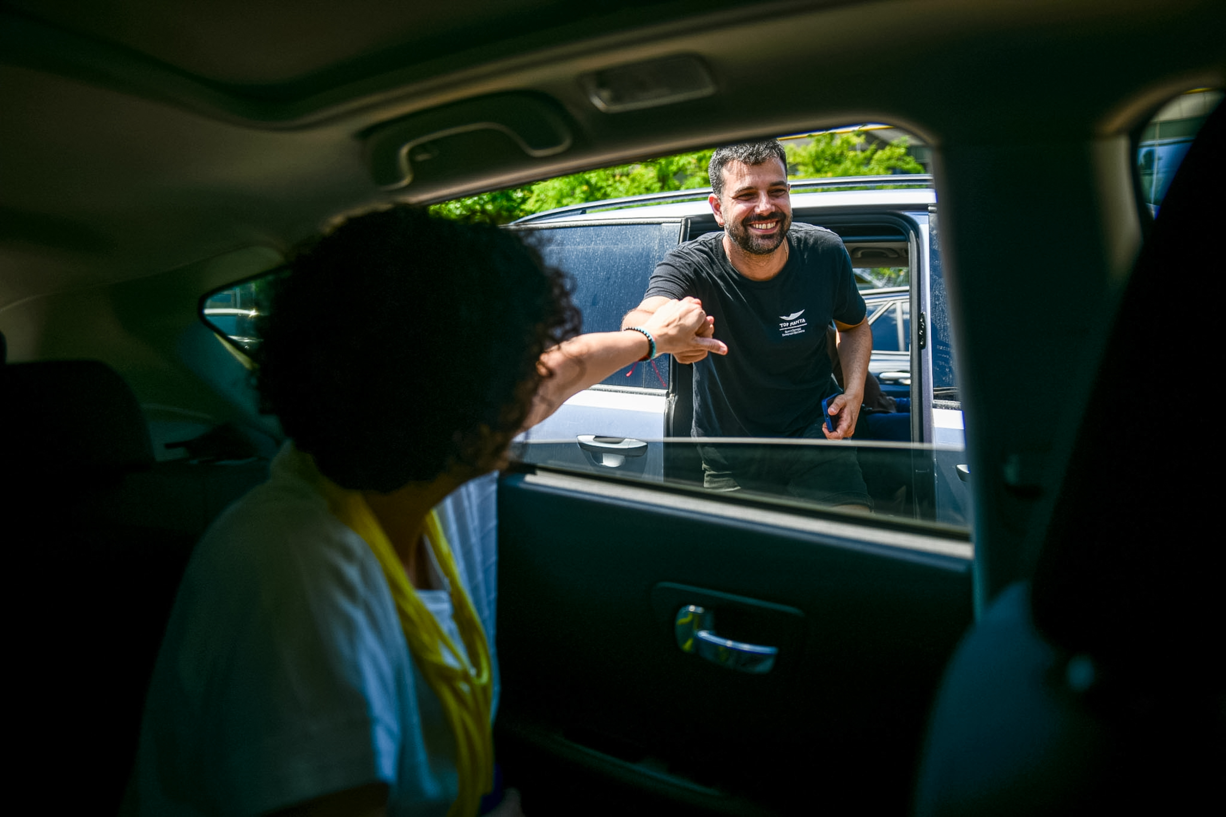 Esquerra Republicana leader Marta Rovira, in the car, and Esquerra Republicana MP Ruben Wagensberg greet before starting a journey by car from Switzerland to return to Catalonia on July 11, 2024