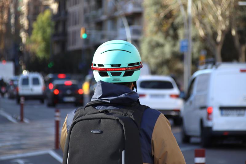 A scooter user rides with a helmet in Barcelona