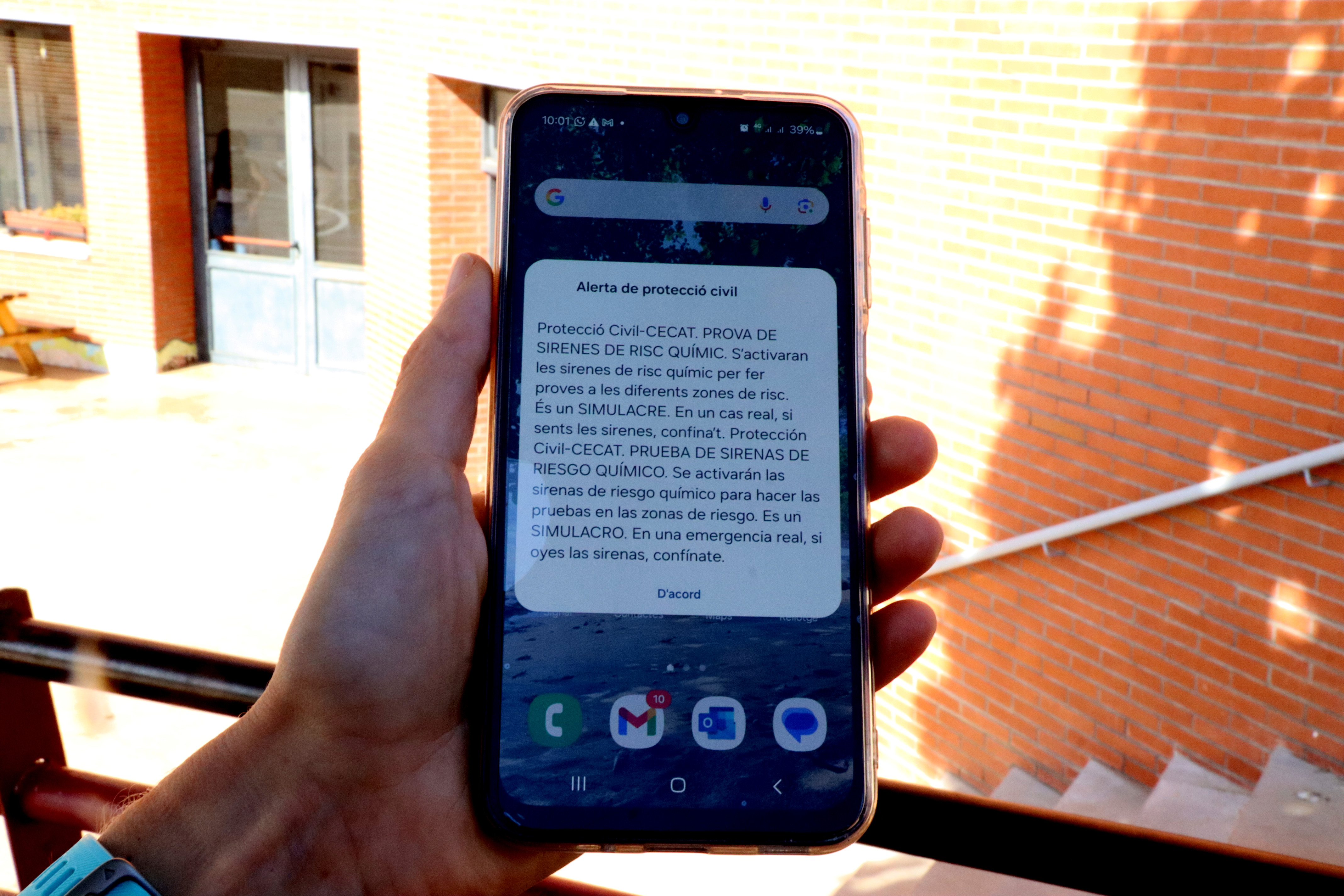 A mobile showing the chemical risk simulation drill alert