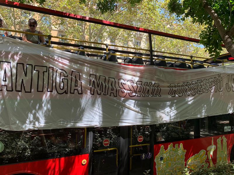 Activists protest by stopping a Barcelona tourist bus