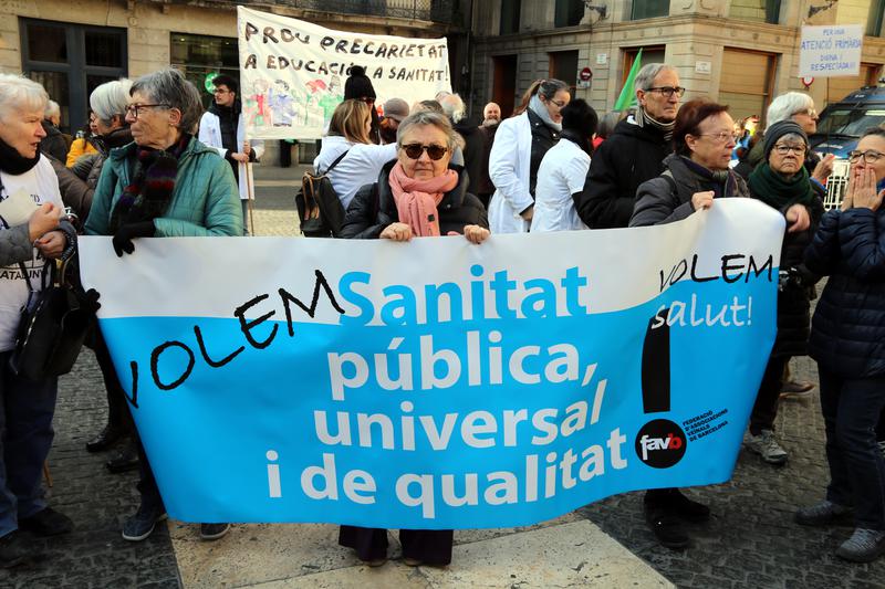A protest banner in Barcelona reads 'Public healthcare, open to all, and of high quality,' January 28, 2023