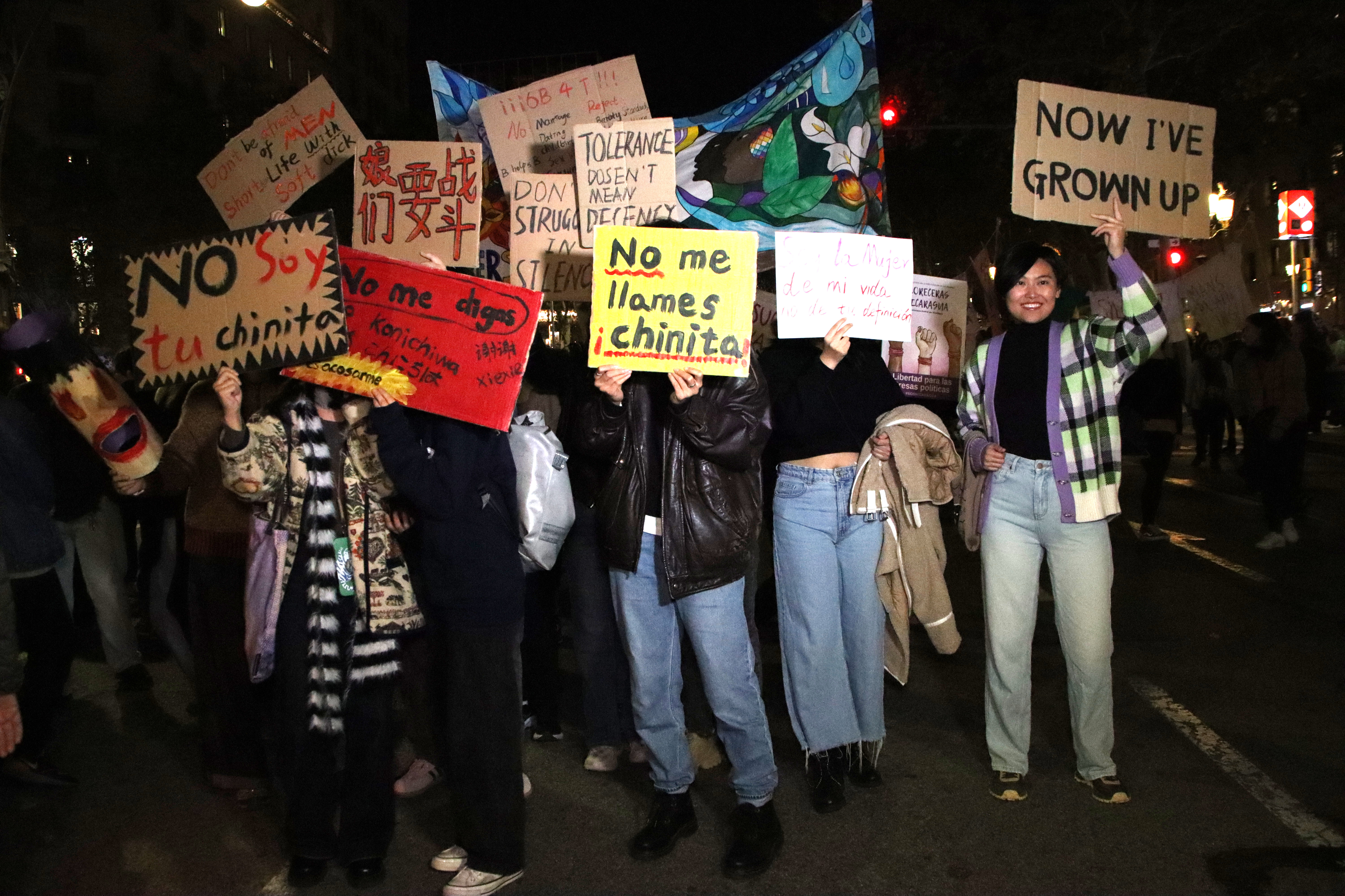 Demonstrators rally on the International Day for the Elimination of Violence Against Women on November 25.