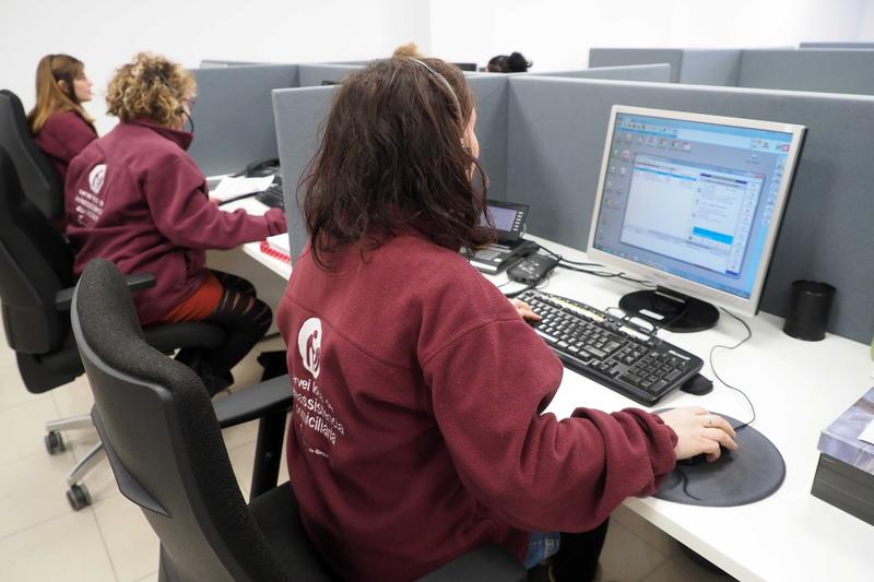 Workers at a customer services center in Girona