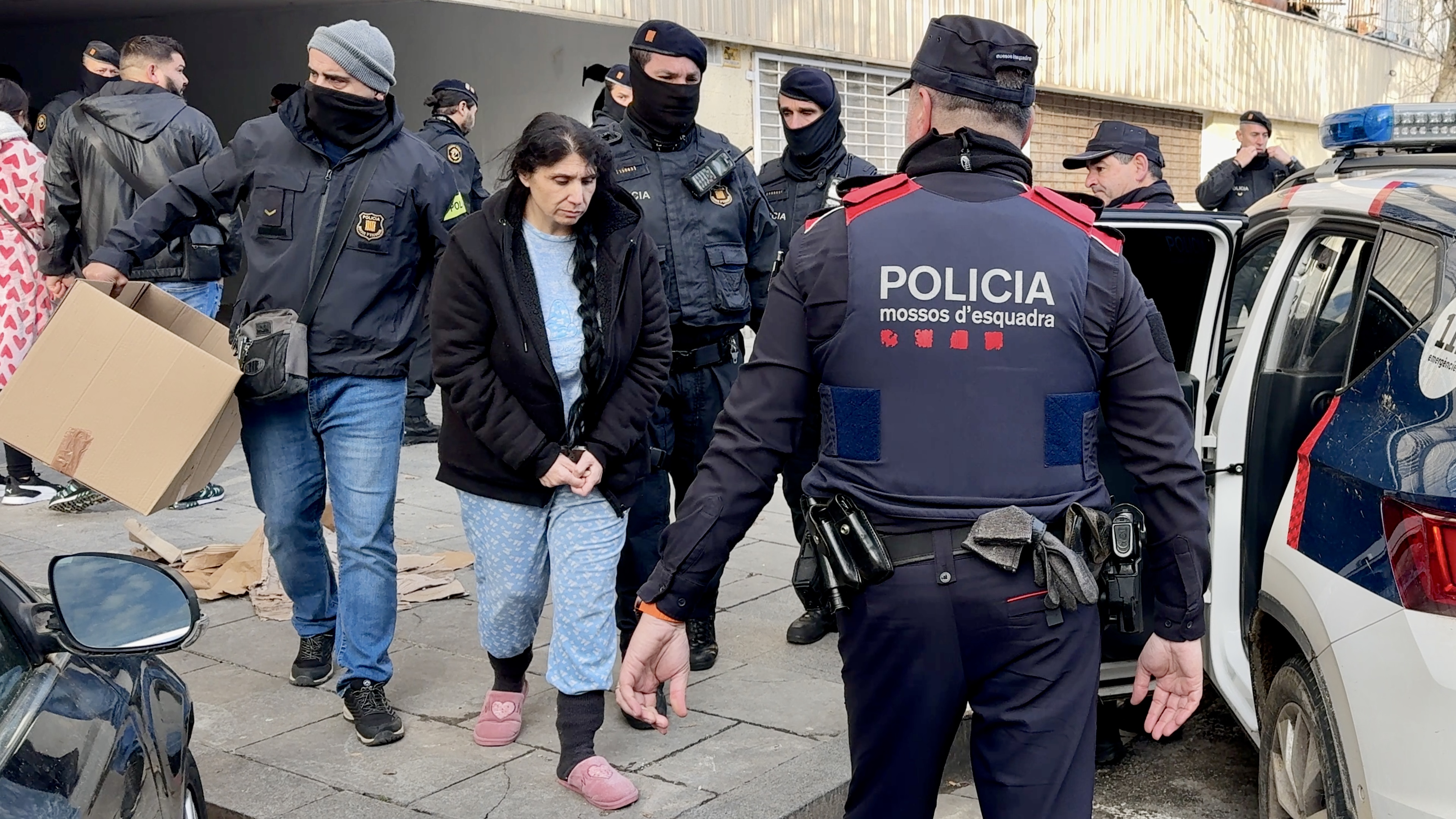 Police arrest a woman in La Mina