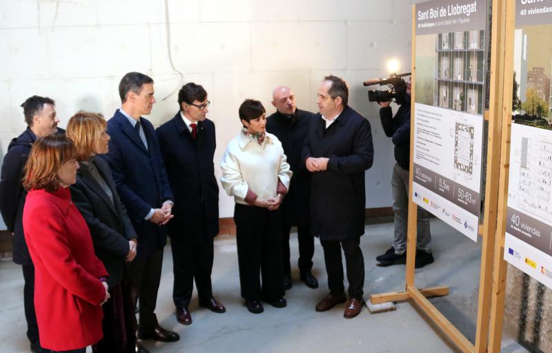 Spanish PM Pedro Sánchez and Catalan president Salvador Illa accompanied by Spain's housing minister Isabel Rodríguez and Catalan territory minister Silvia Paneque during a visit to public houses in Sant Boi de Llobregat on February 13, 2025