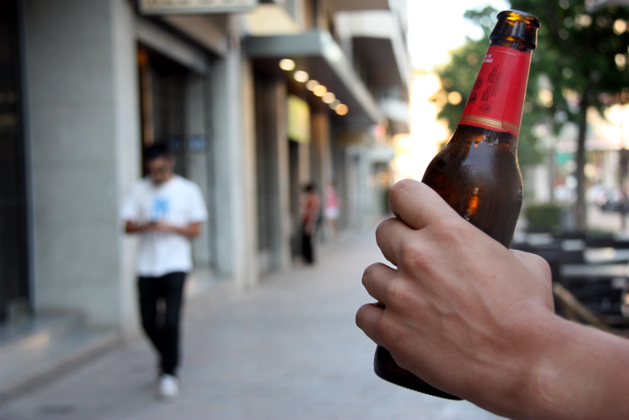 A person holds a beer in a file picture