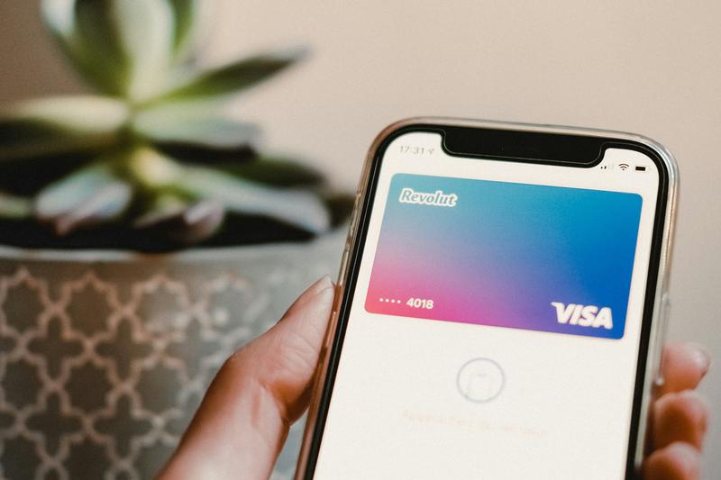 A phone shows a virtual credit card of the British fintech, Revolut