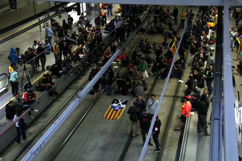 Pro-independence protesters block the AVE high speed rail line in Girona on October 1, 2018