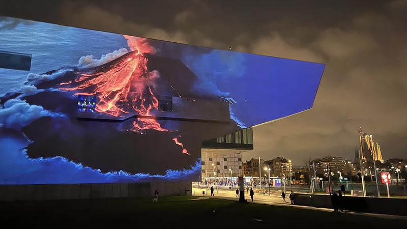 Joan Fontcuberta's 'Gènesi.IA', virtual landscapes based on the verses of Genesis, is projected onto the DHub façade