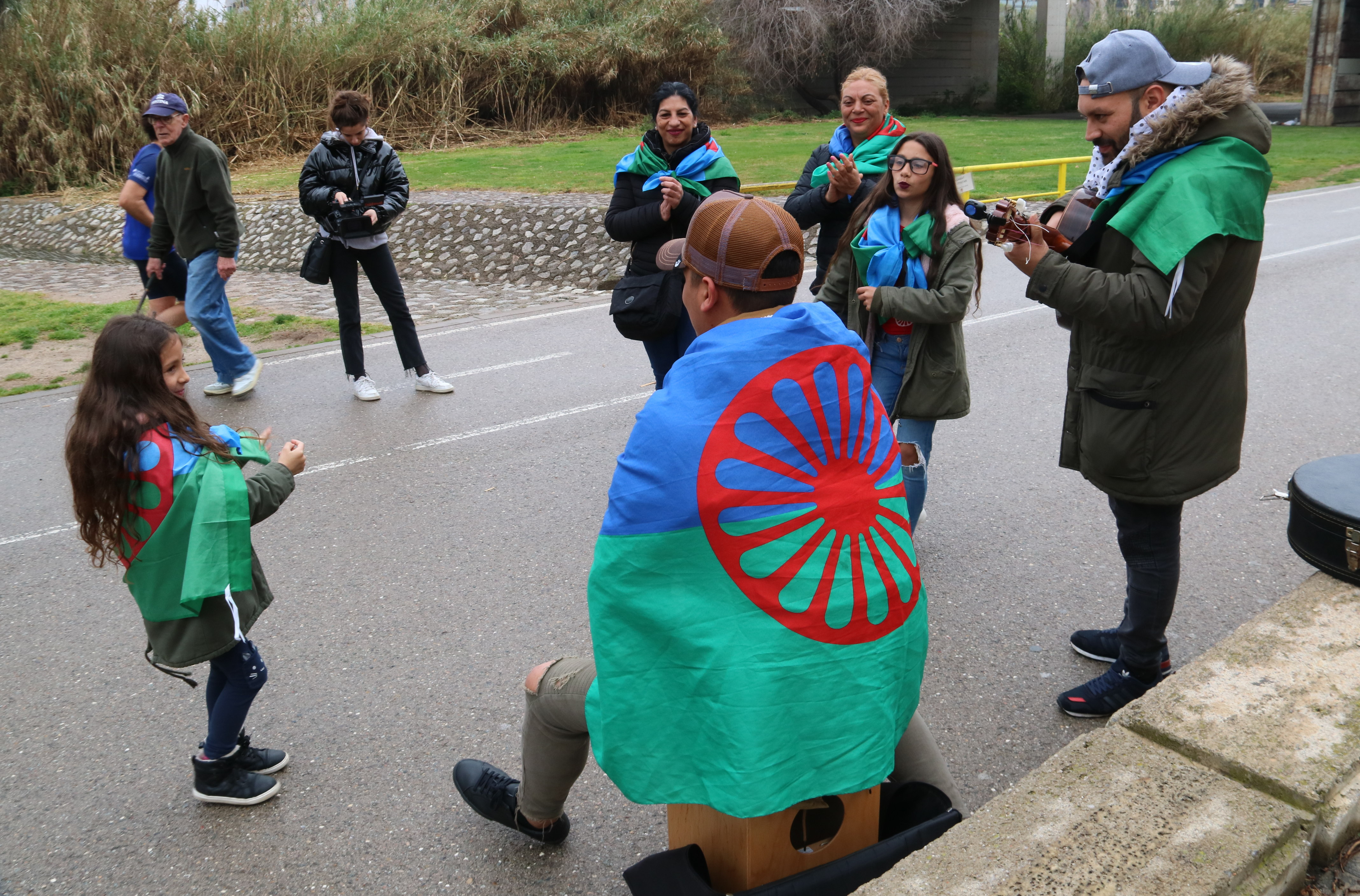 A family with the Roma community flag celebrating the International Romani Day on April 8, 2018
