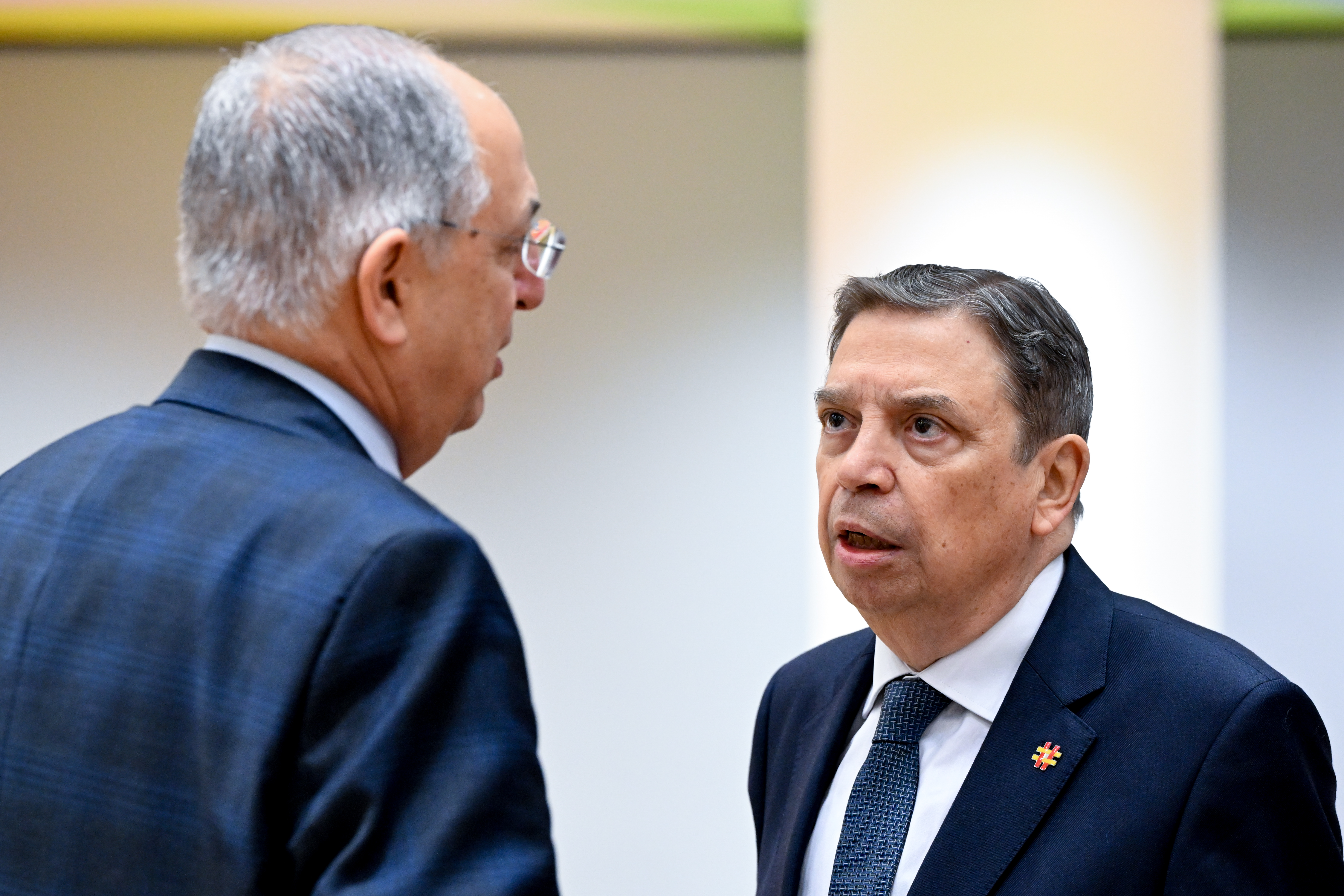 Spain's Agriculture and Fisheries Minister Luis Planas talks with EU Fisheries Commissioner Costas Kadis during 2026 quota negotiations in Brussels