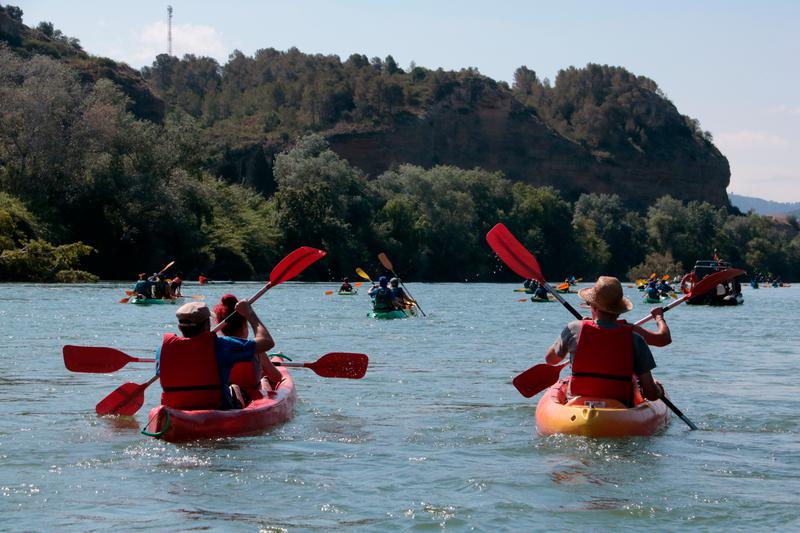 Dozens of people kayak down the Ebre river to demonstrate against the water transfer on June 8, 2025