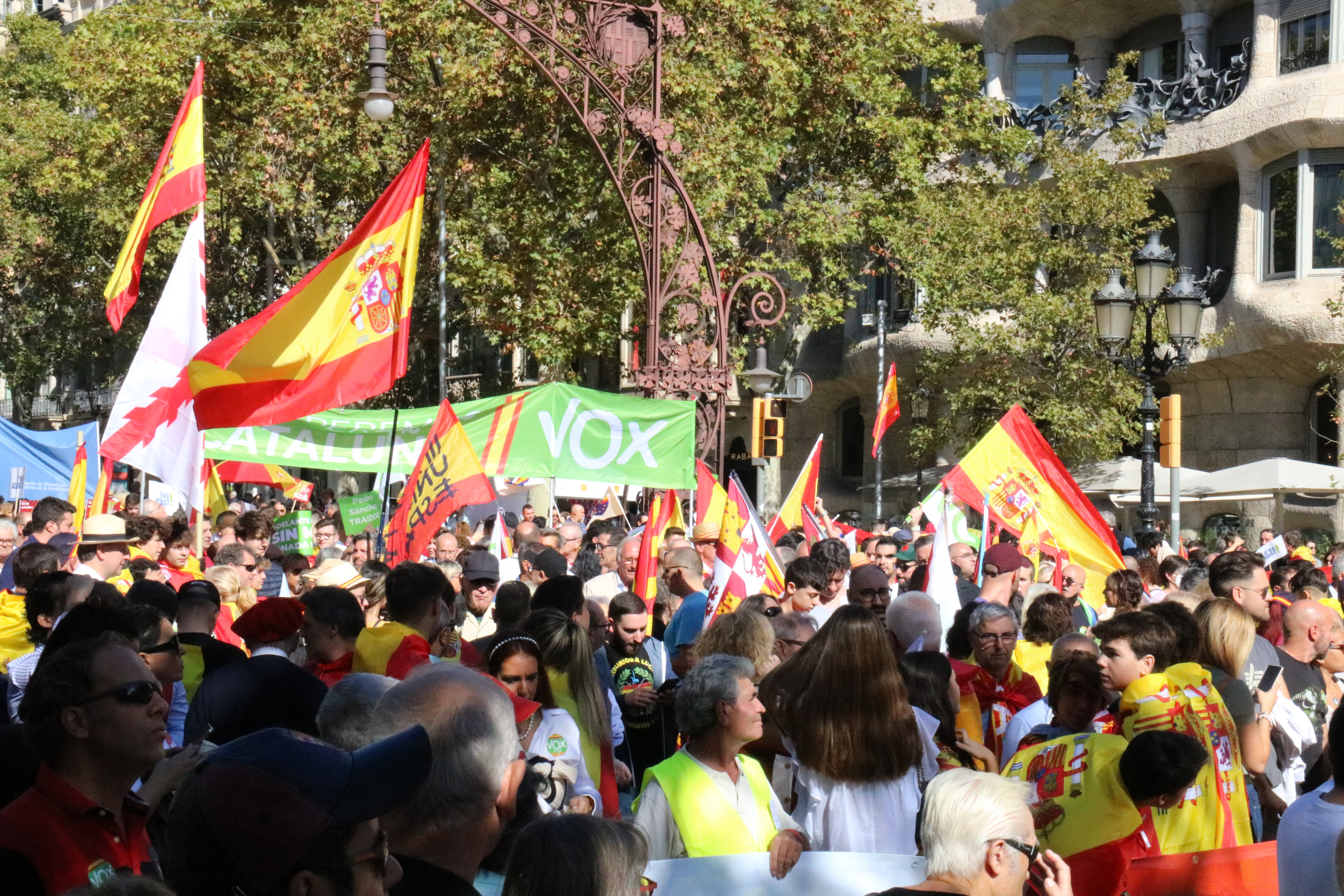 Spanish and far-right Vox party flags seen during a demonstration in the center of Barcelona on Spain's National Day, October 12, 2022