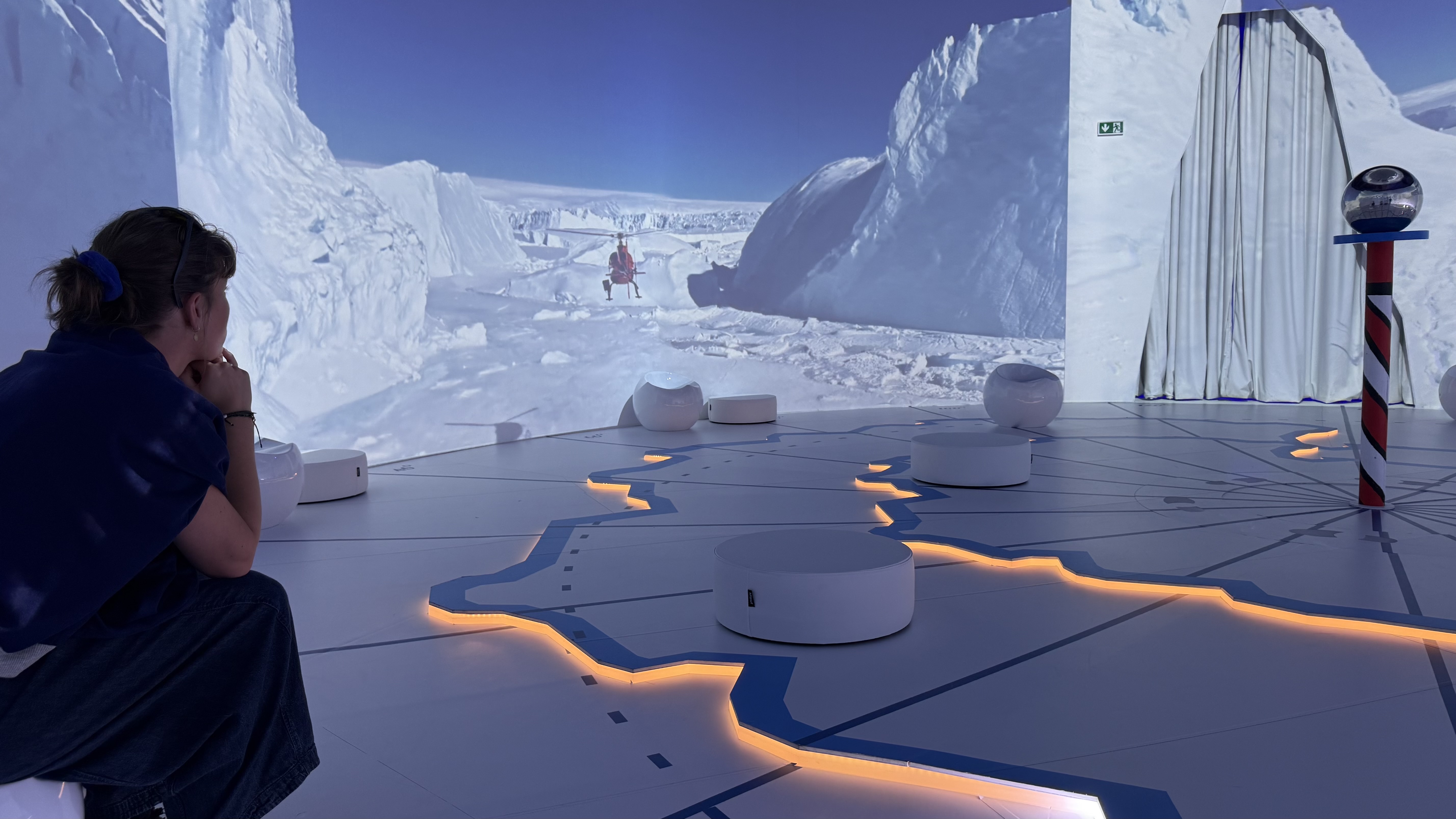 A person sitting in one of the 'Antarctica Experience' rooms