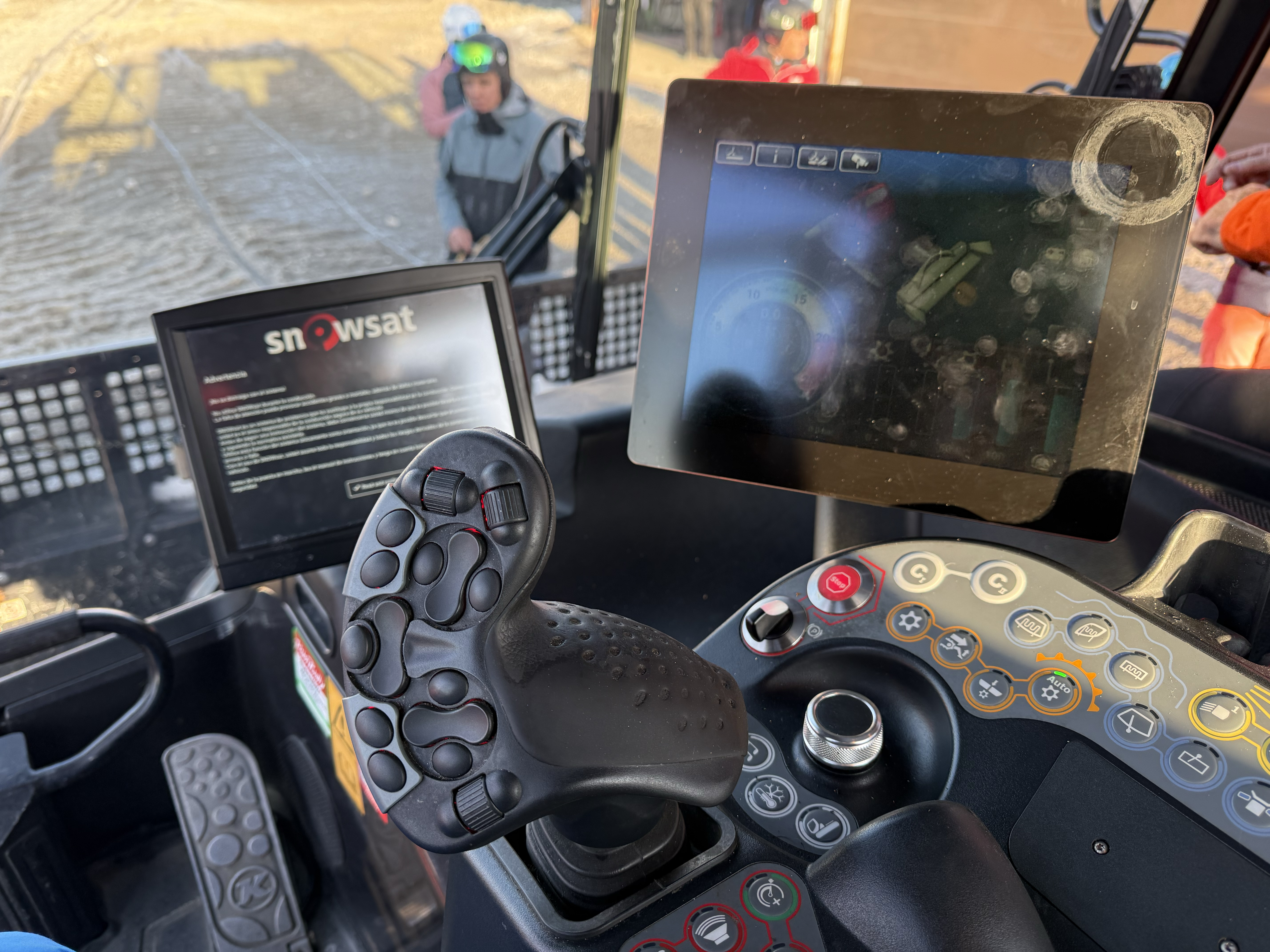 The controls on the inside of a machine to treat snow on ski slopes