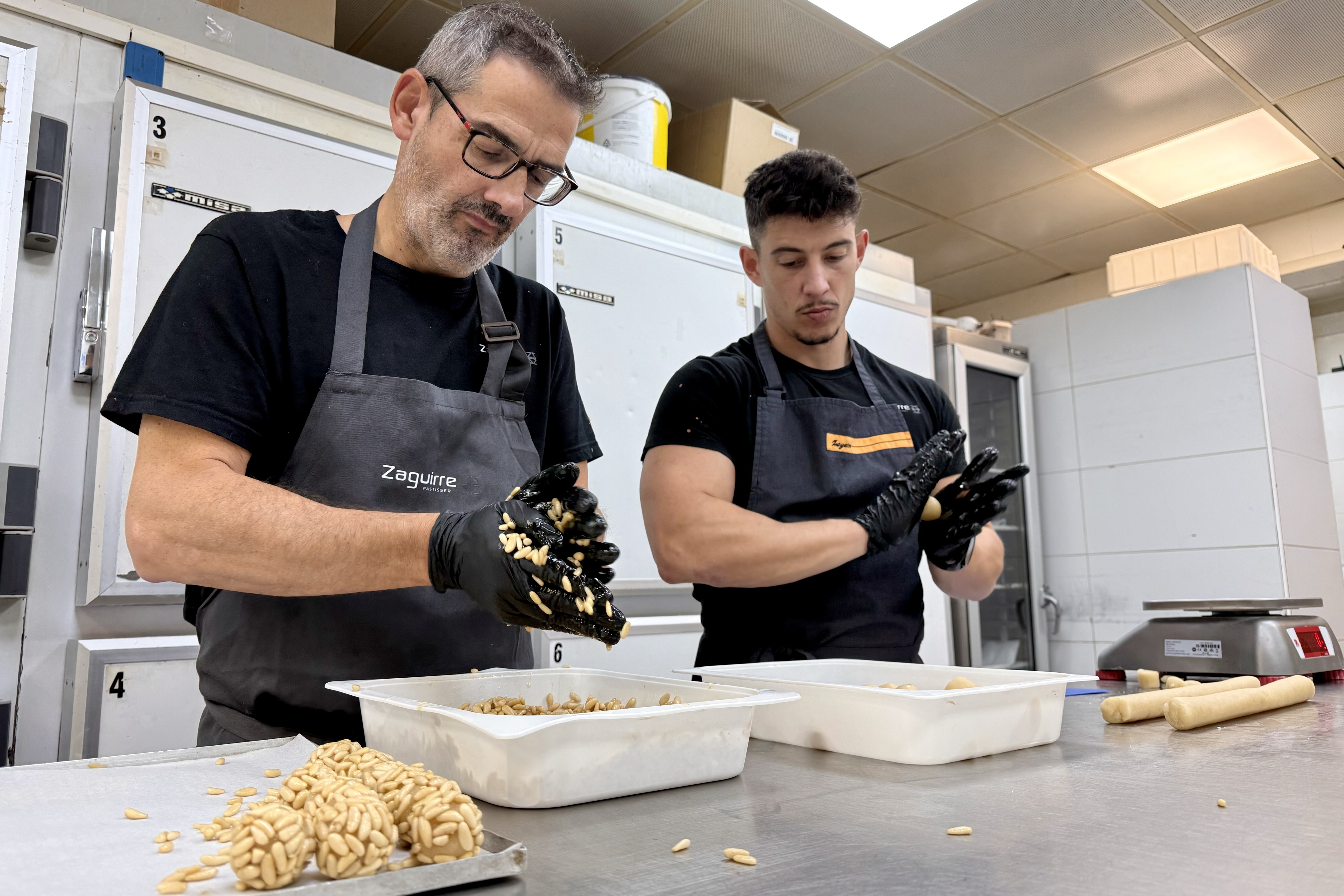 Pastry chefs making 'panellets' at Zaquierre pastry shop