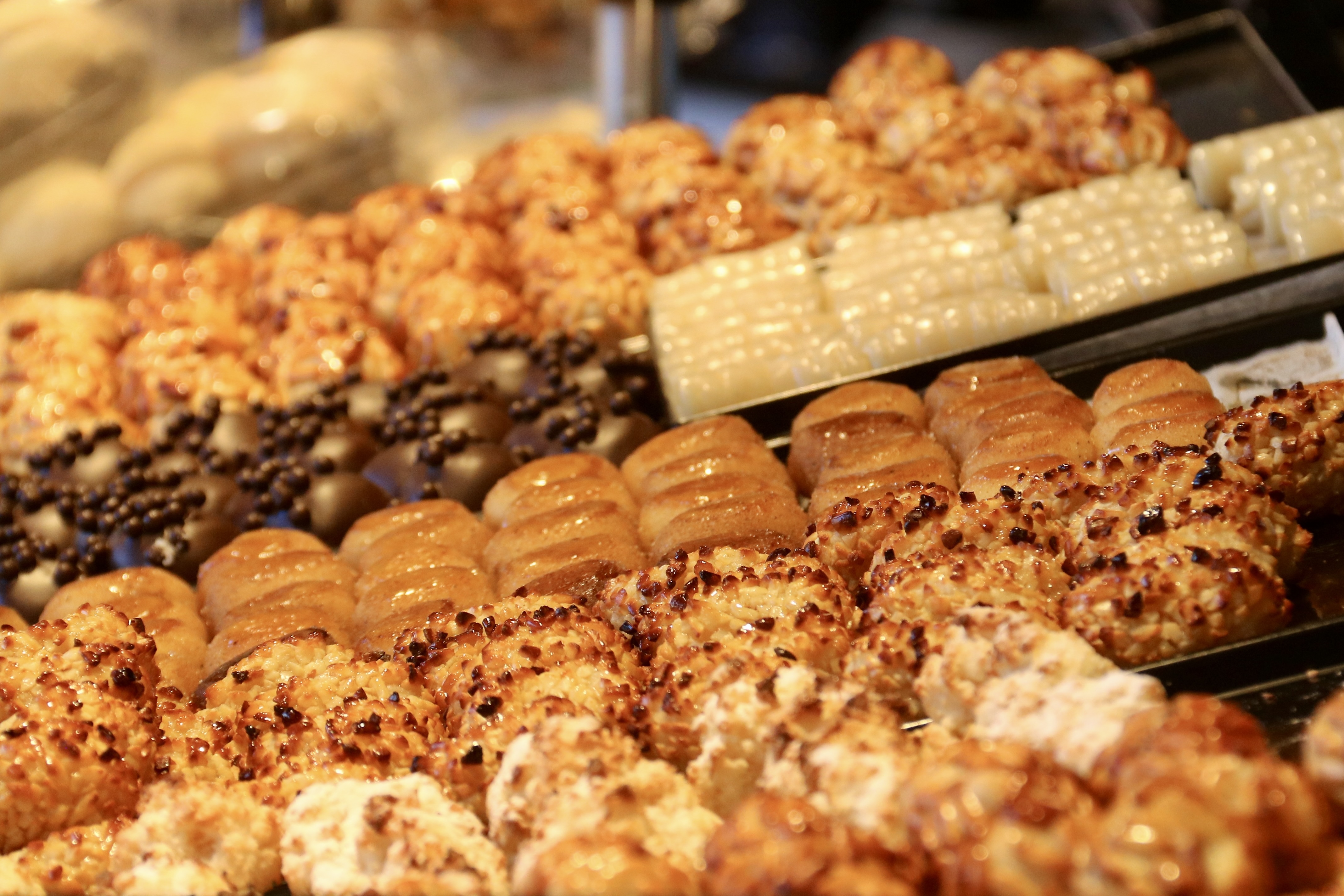 Different versions of 'Panellets,' Catalonia's traditional marzipan treats enjoyed during 'La Castanyada'