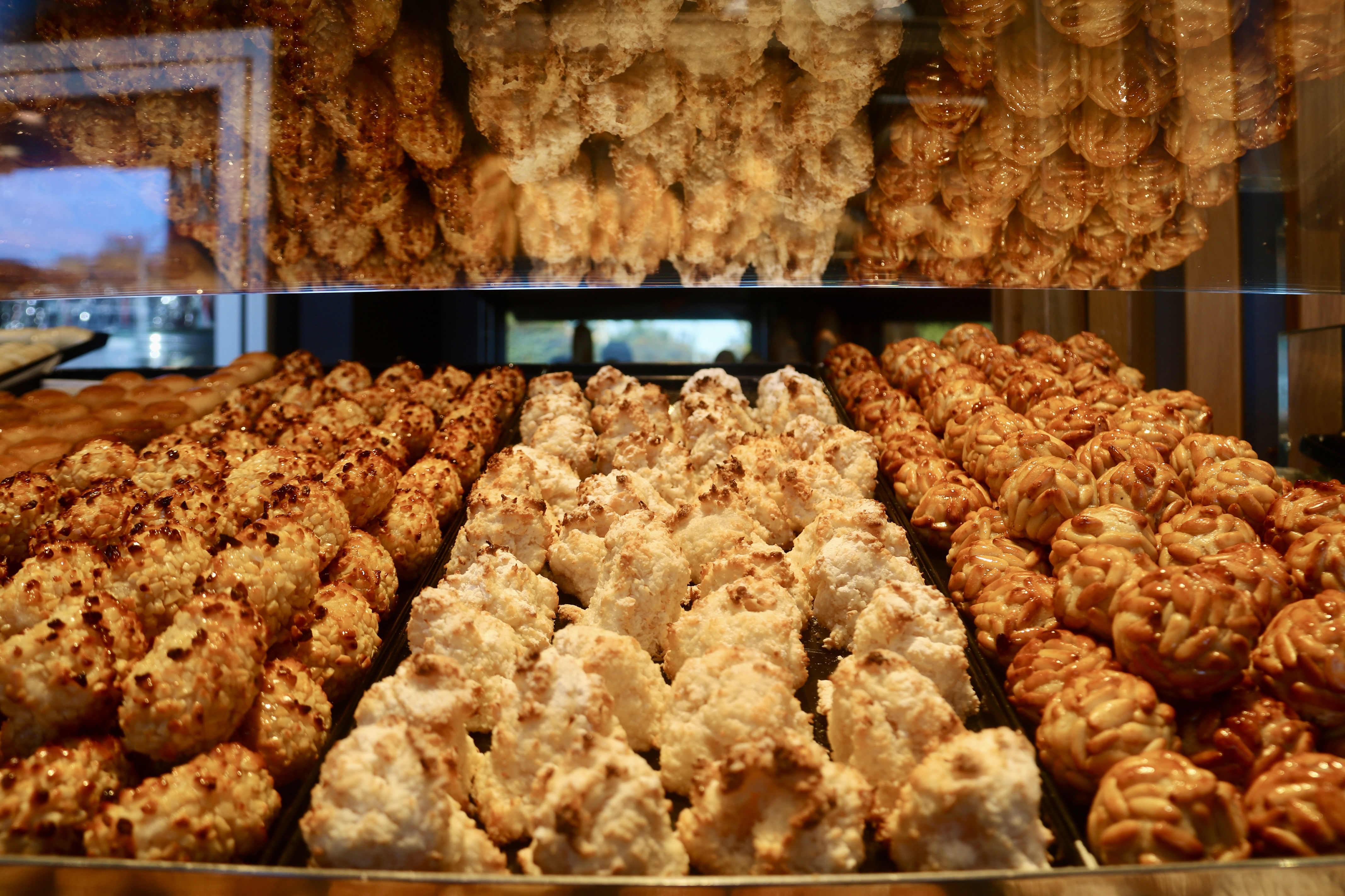 Almond, coconut, and pine nut versions of 'panellets,' Catalonia’s traditional marzipan treats enjoyed during La Castanyada