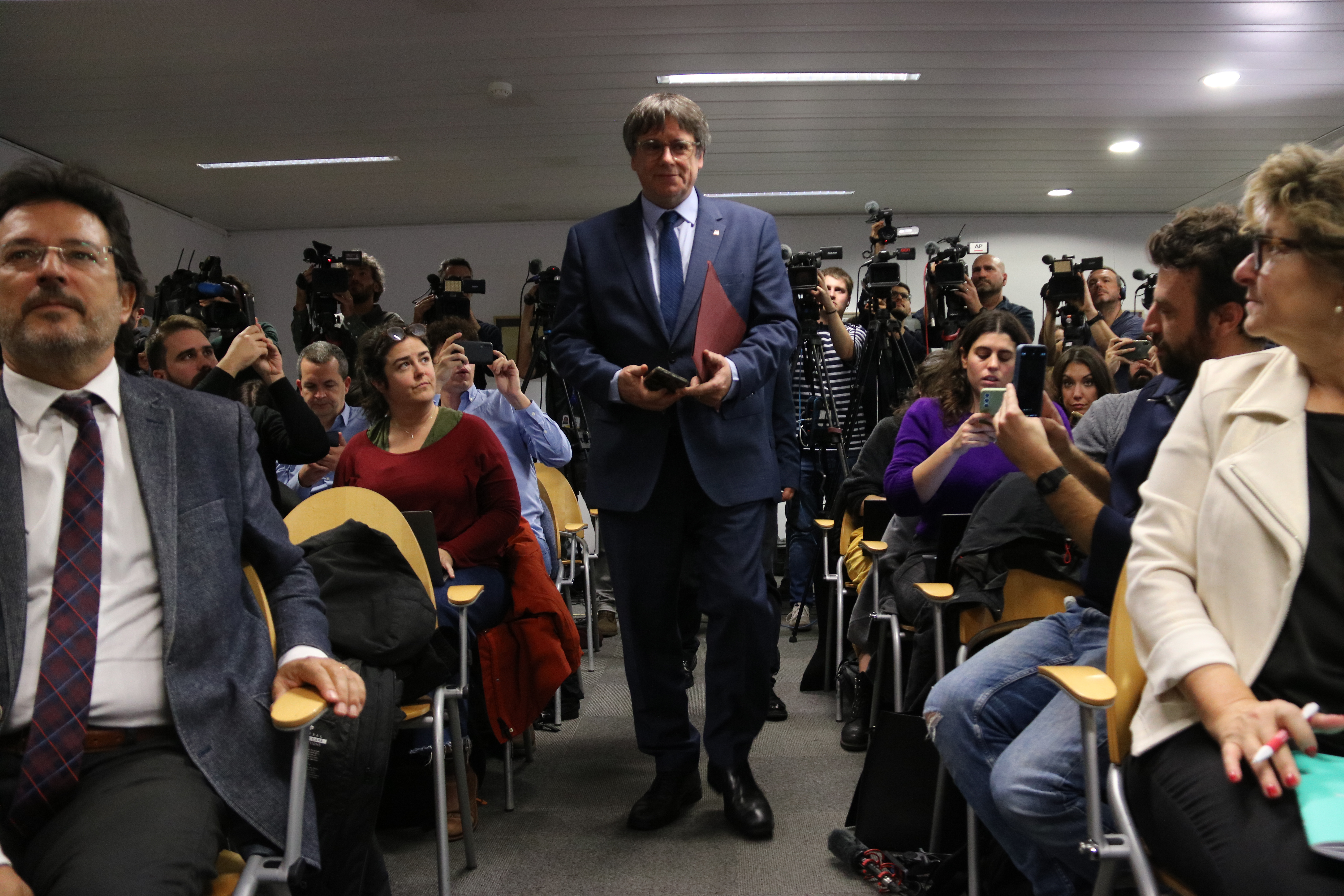 Former Catalan president Carles Puigdemont arrives at a press conference in Brussels on November 9, 2023