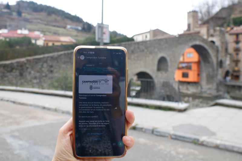 A phone showing the touristic guide in Camprodon