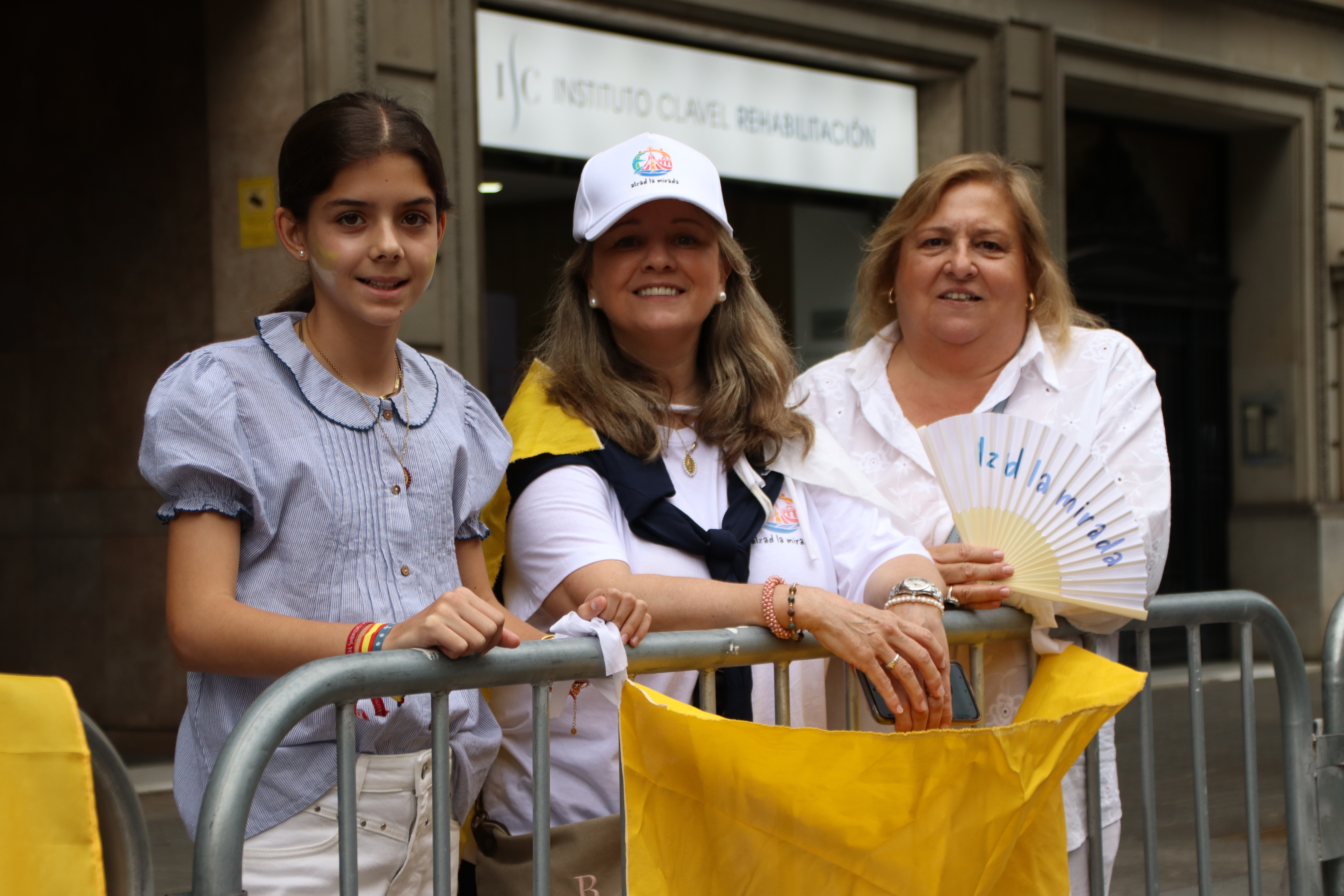 A group of women reserve a front row seat to see Leo XIV in the popemobile
