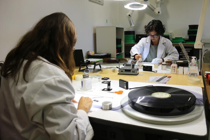 Workers restoring old film at the Filmoteca de Catalunya's base in Terrassa