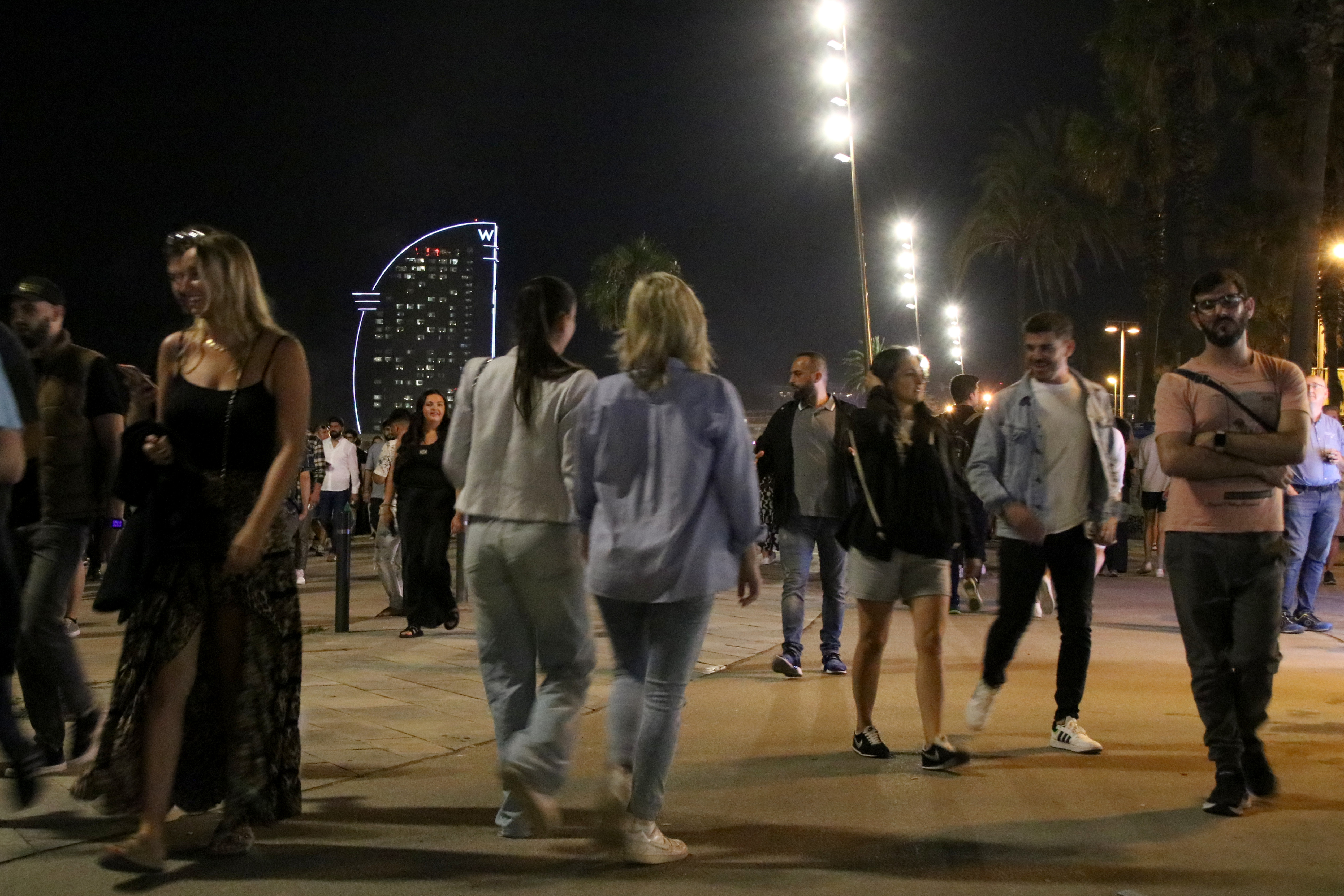 Thousands of people walk by Barceloneta beach on June 23, 2024 night during Sant Joan festivities