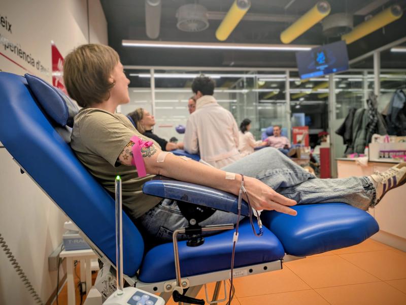 A woman donates blood