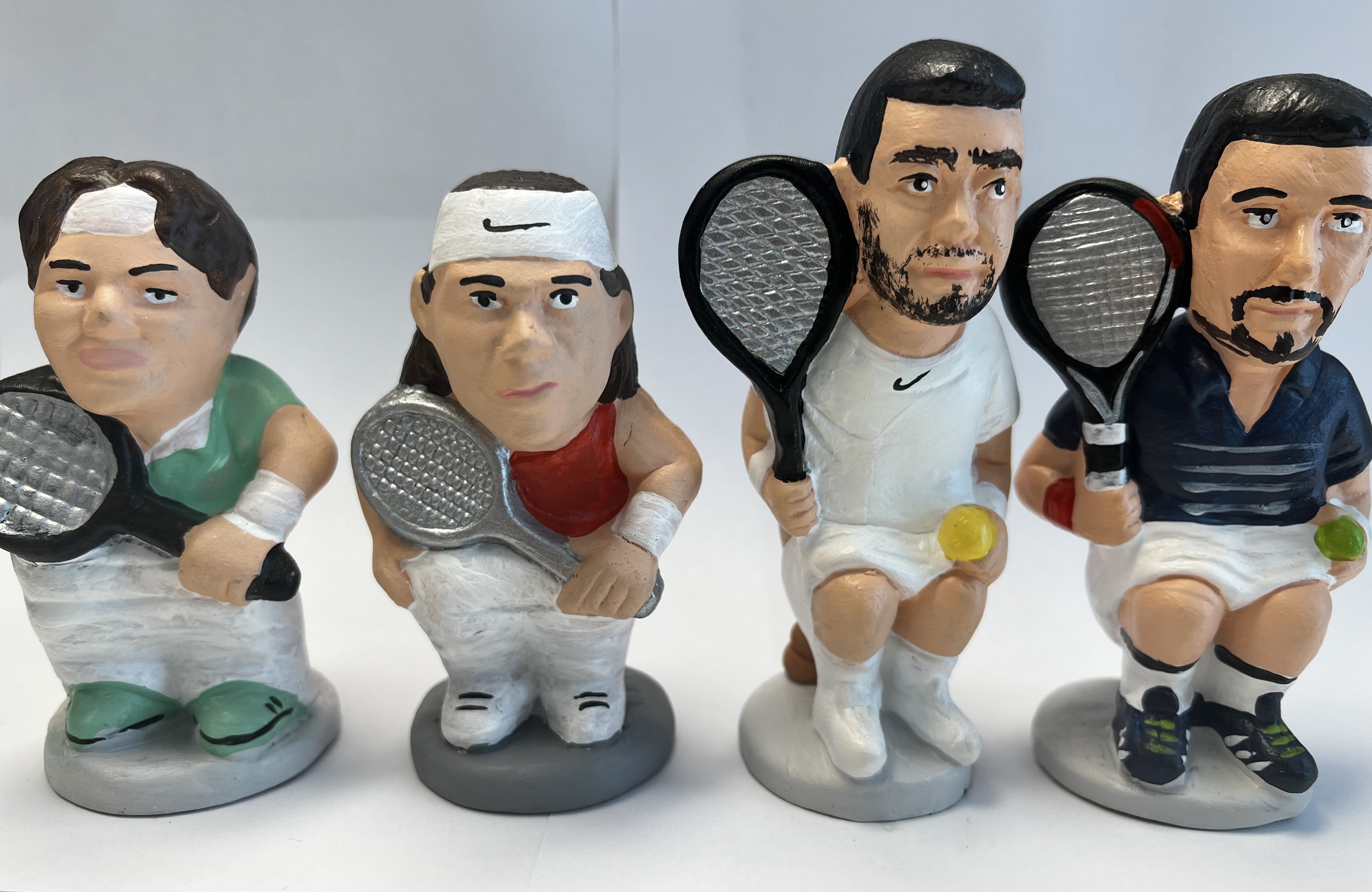 The caganer nativity scene figurines of tennis player Roger Federer, Rafael Nadal, Carlos Alcaraz, and Novak Djokovic