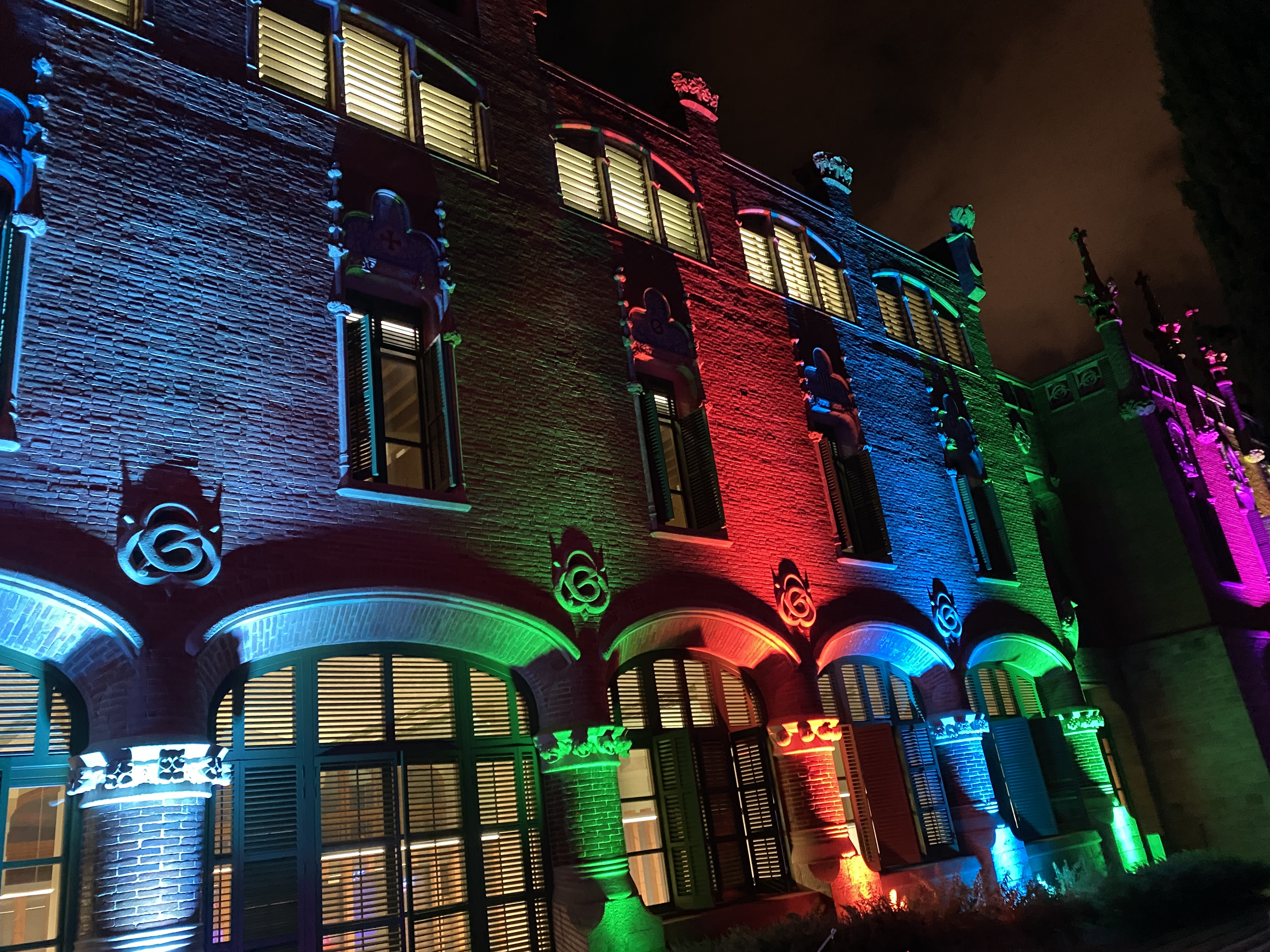 Multicolored lights highlight the complex's modernist design