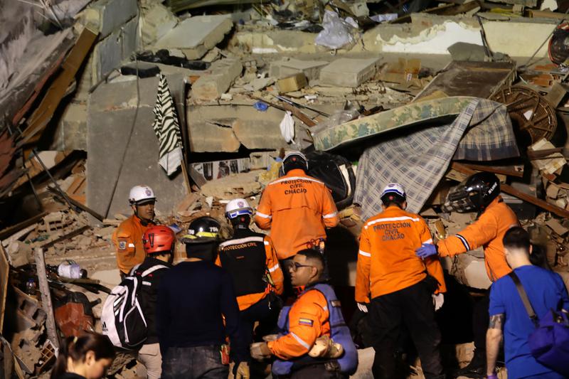 Emergency teams search for victims among the rubble caused by the two earthquakes that have shaken Venezuela
