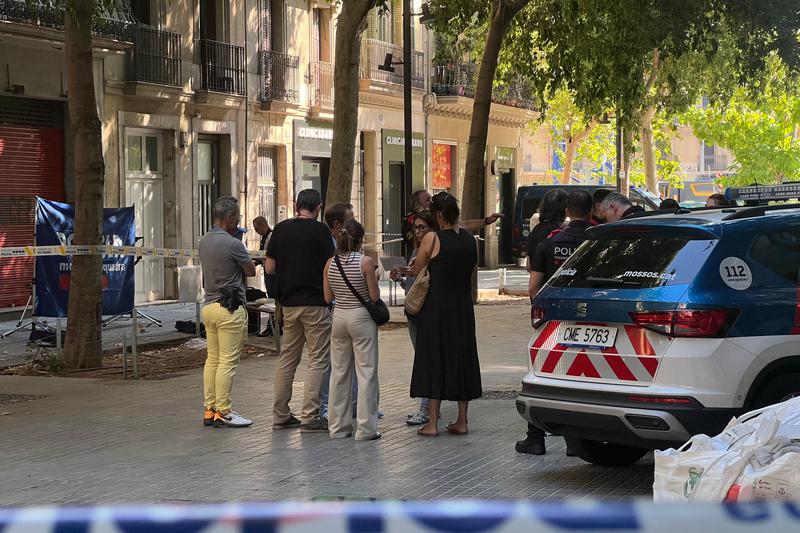 Mossos d'Esquadra officers on Consell de Cent Street in Barcelona following a fatal shooting