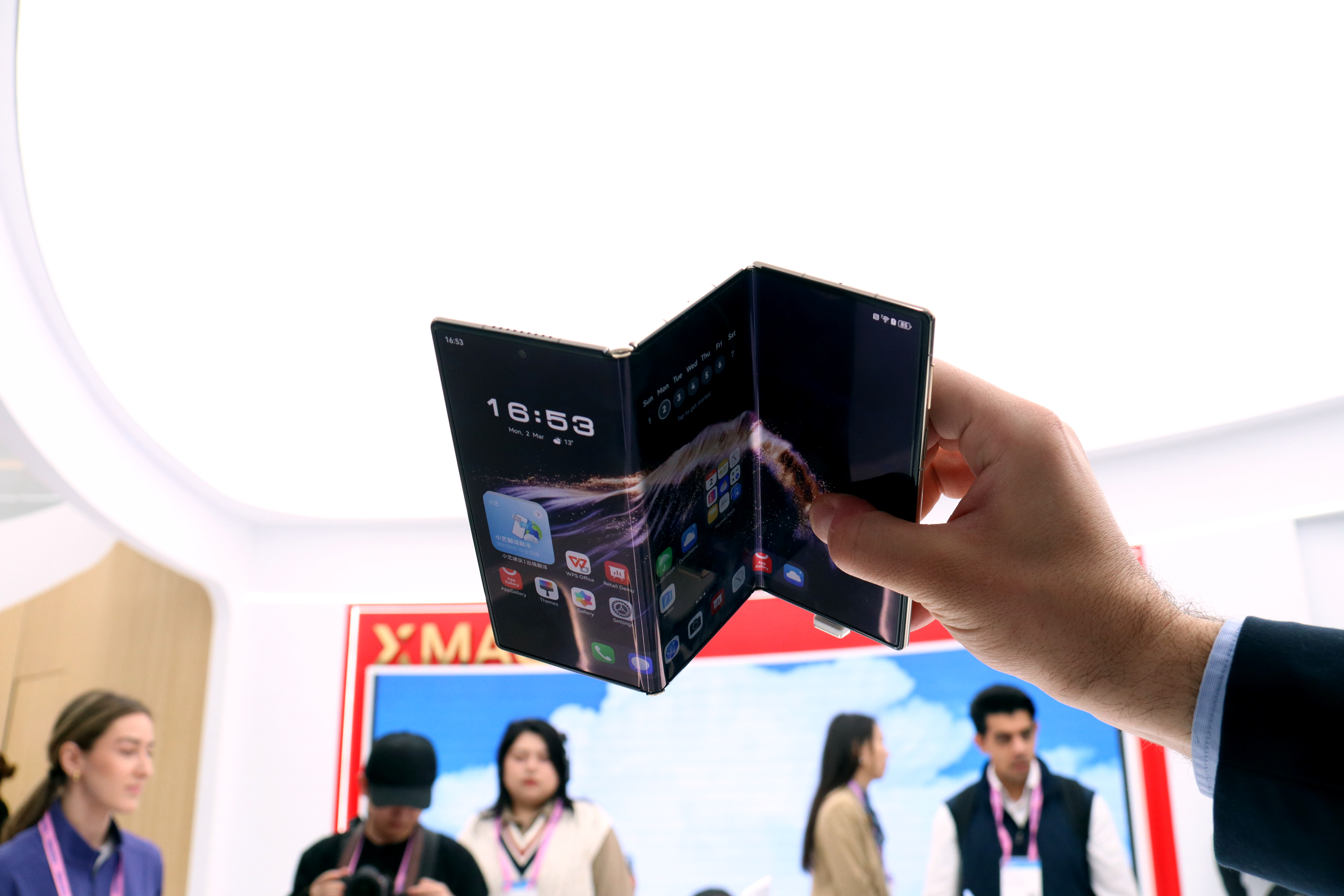 A foldable cell phone at the Xiaomi booth at MWC 2026