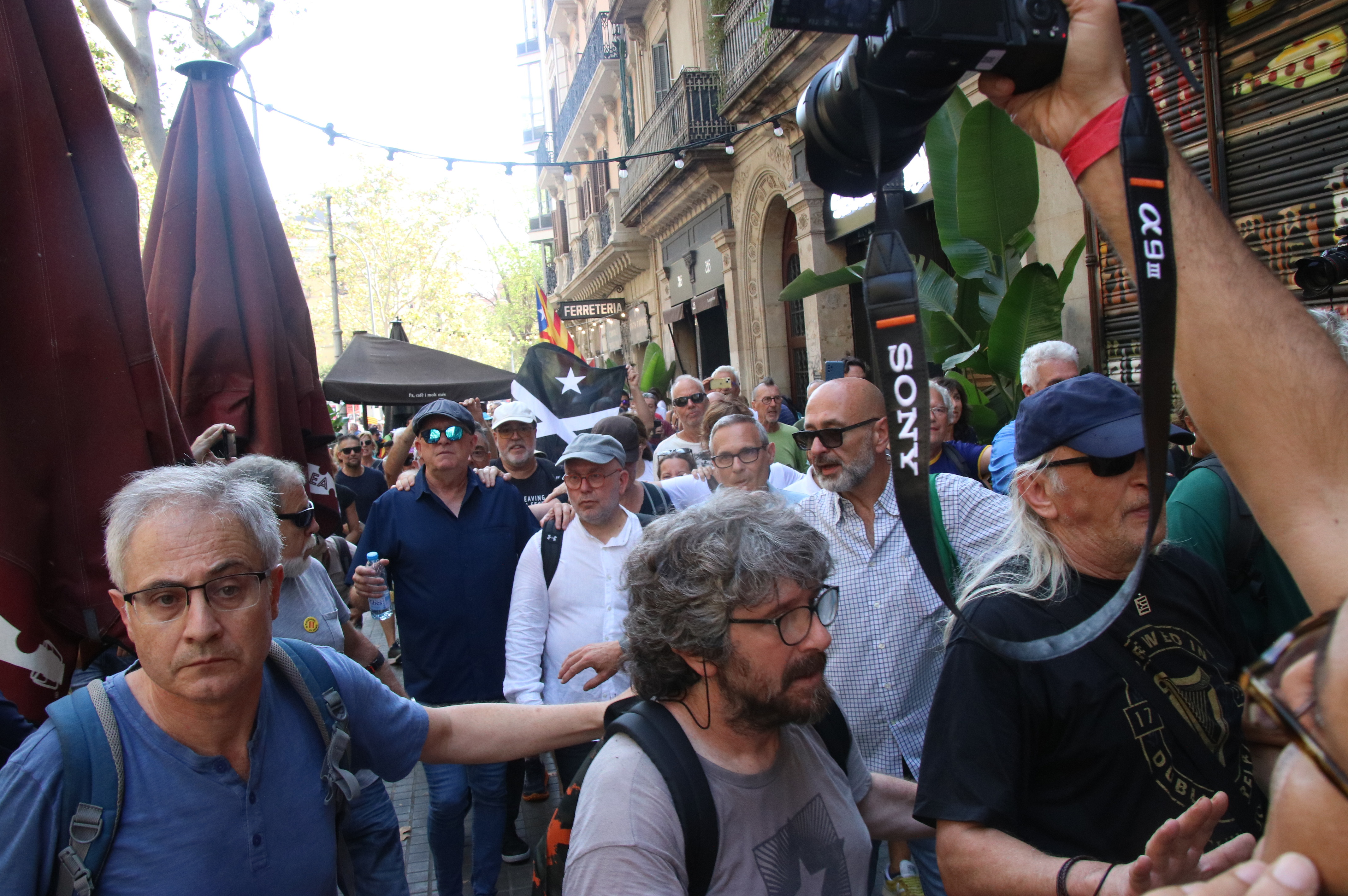 Close members of Carles Puigdemont including lawyer Gonzalo Boye walking around Barcelona after the former president appeared in the Catalan capital on August 8, 2024