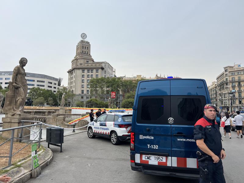 Catalan police vans and officers restricting access to Plaça Catalunya metro and train station on June 27, 2023