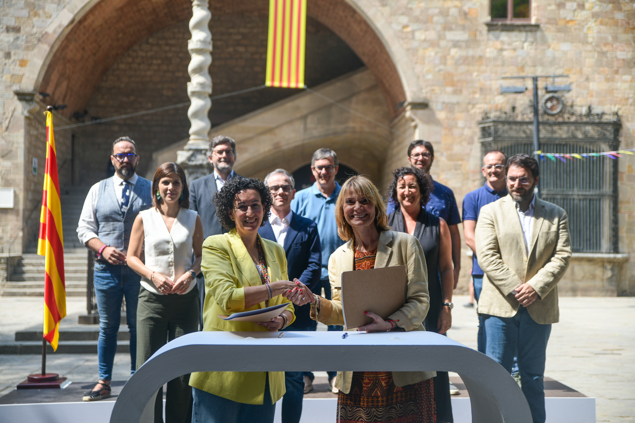 Members of the Catalan Socialists and Esquerra Republicana sign their investiture deal